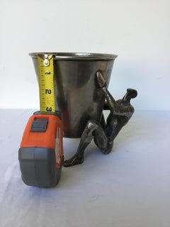 1970s Silver Plate Man Holding Vessel