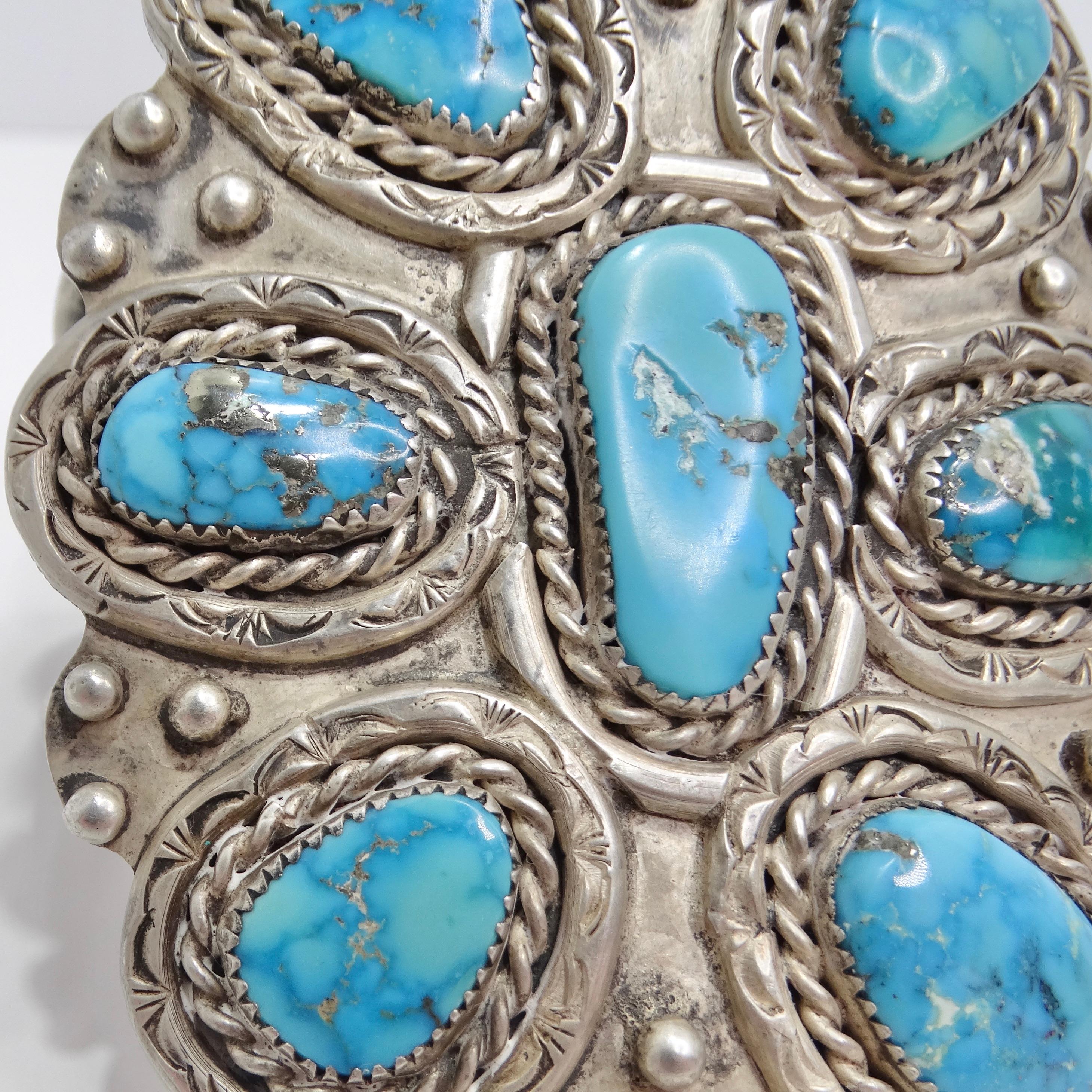 Introducing the exquisite 1970s Silver Turquoise Cuff Bracelet, a vintage treasure that exudes timeless elegance and eye-catching beauty. Crafted from sterling silver, this cuff bracelet features a whimsical arrangement of bright blue turquoise