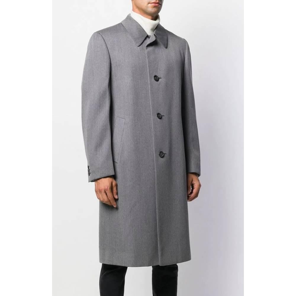 Simon Ackerman grey wool long coat. Classic collar, front closure with buttons and welt pockets. Lined.

Size: 46 IT

Flat measurements
Height: 111 cm
Bust: 53 cm
Shoulders: 40 cm
Sleeves: 66 cm

Product code: A5560

Composition: Wool

Made in: