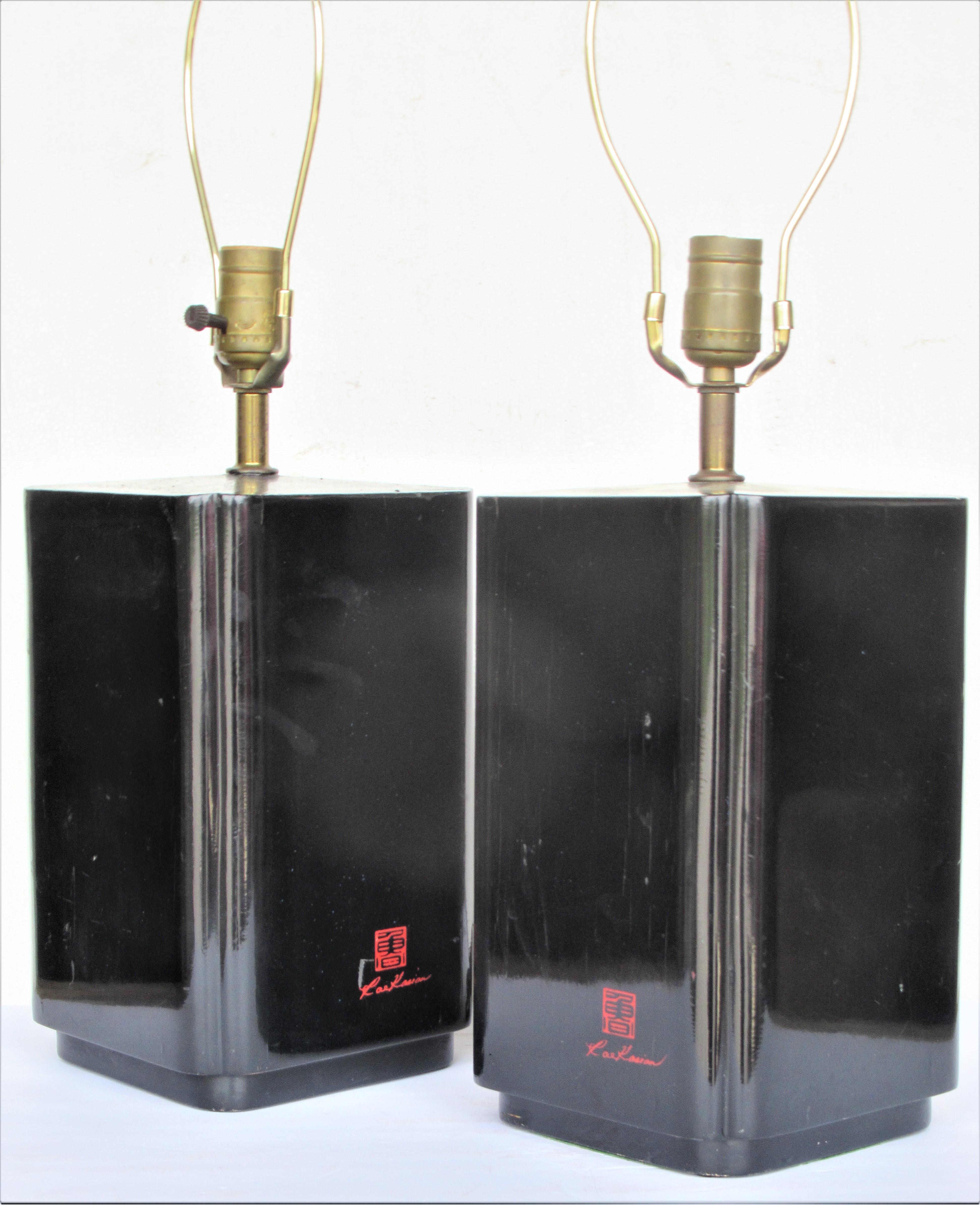 A pair of black lacquered wood table lamps by Korean American designer Roe Kasian ( signed at bottom front side ) Great looking glamorous lamps in the Asian Modern / Hollywood Regency Style - circa 1970. Look at all pictures and read condition