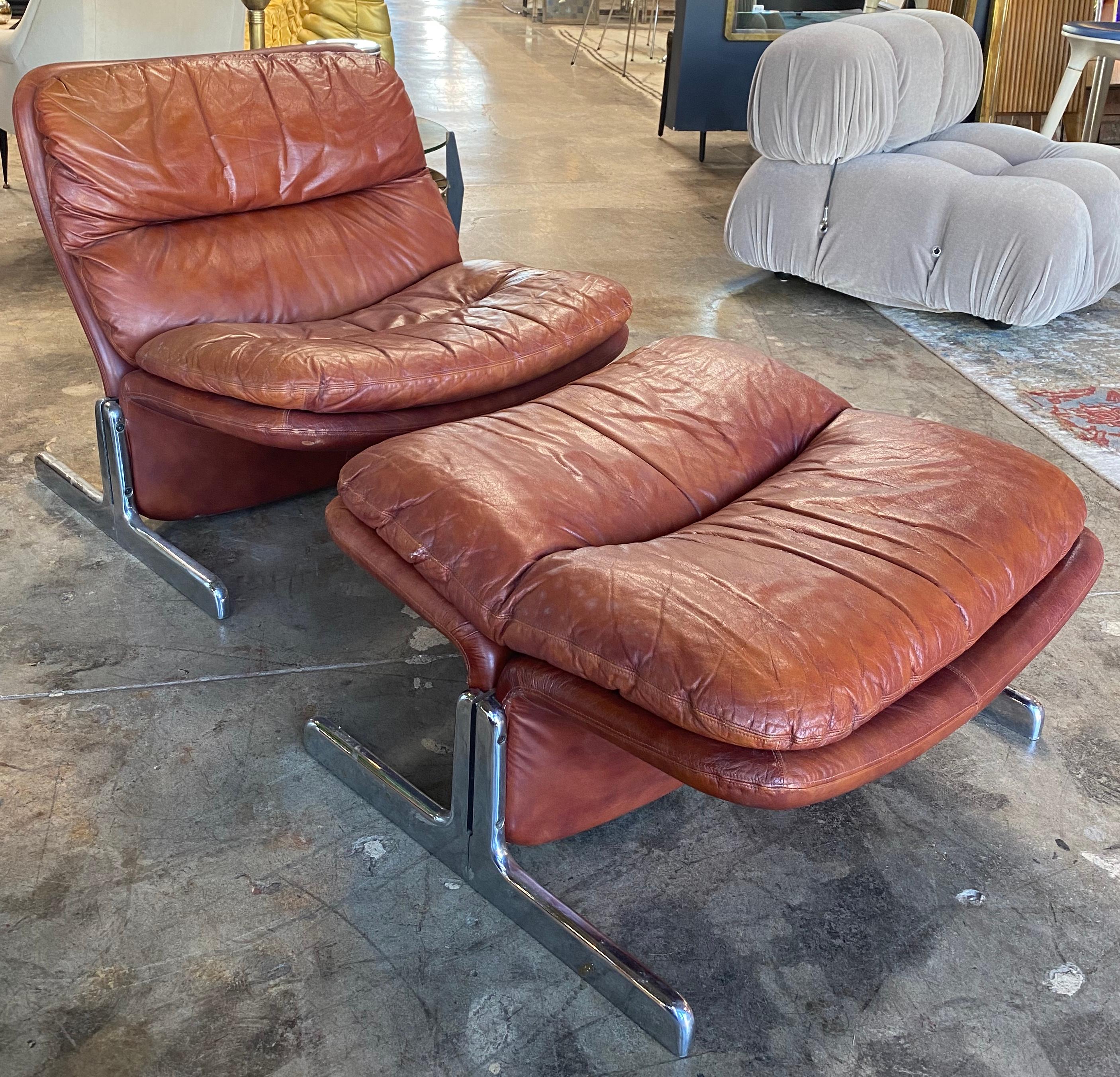 1970s modern leather lounge chair & ottoman by Tittina Ammannati & Vitelli Giampiero for Brunati in Italy.
Brown leather & chrome plated steel. Midcentury Modern Mad all the way.
Dimensions: Chair 28 1/2