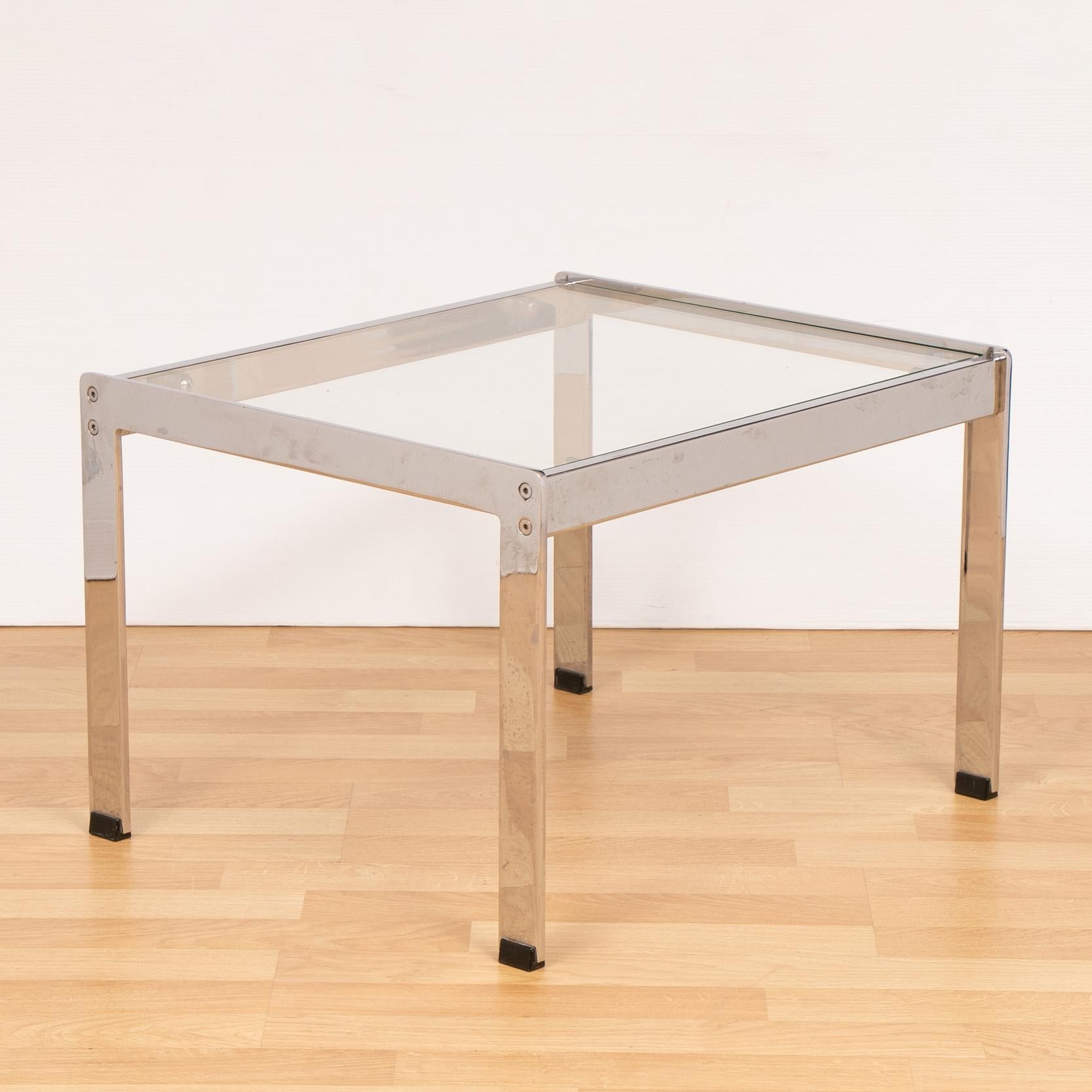 1970s chrome and glass coffee table designed by Richard Young for Merrow Associates. Solid and well made with toughened glass which has just been replaced. There are some minor signs of wear and tear to the chrome which you'd expect from an item of
