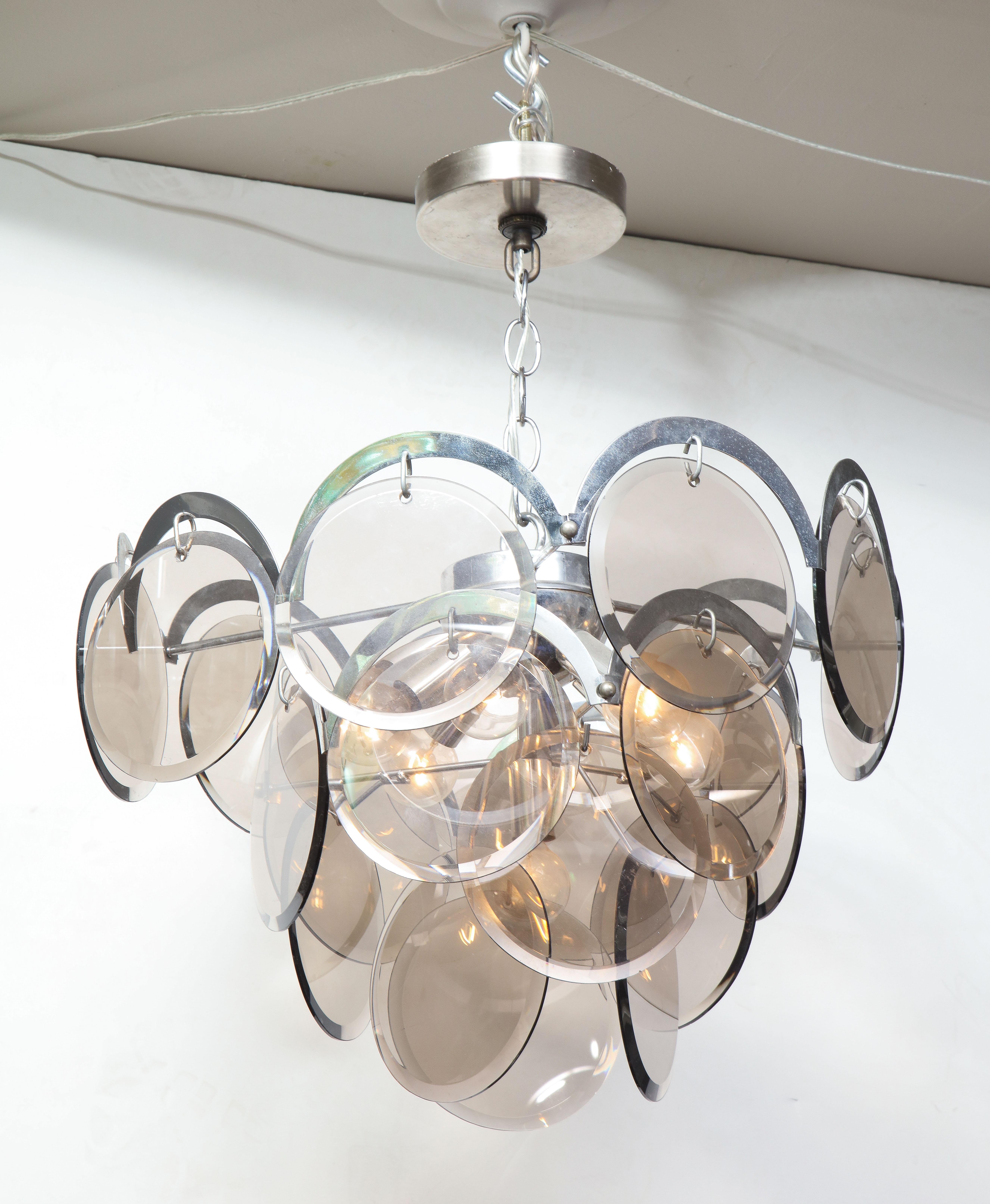 Vintage chandelier is available for purchase immediately. Stainless steel lightly shows signs of aging.
