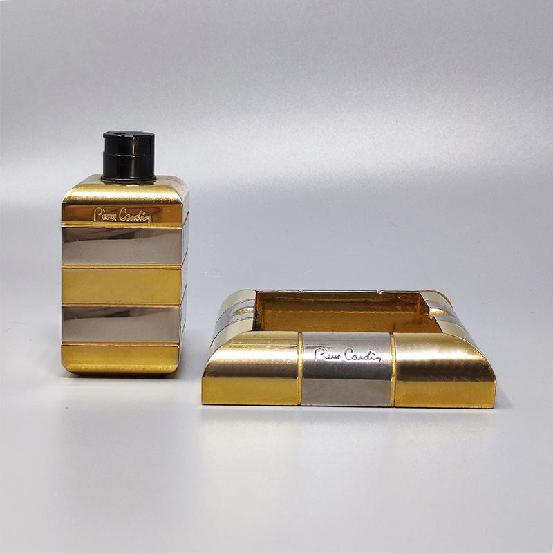 1970s Gorgeous smoking set by Pierre Cardin in brass and metal. Made in France. The table lighter works. This smoking set is in excellent condition and it's signed 
Dimension :
Table Lighter
1,57