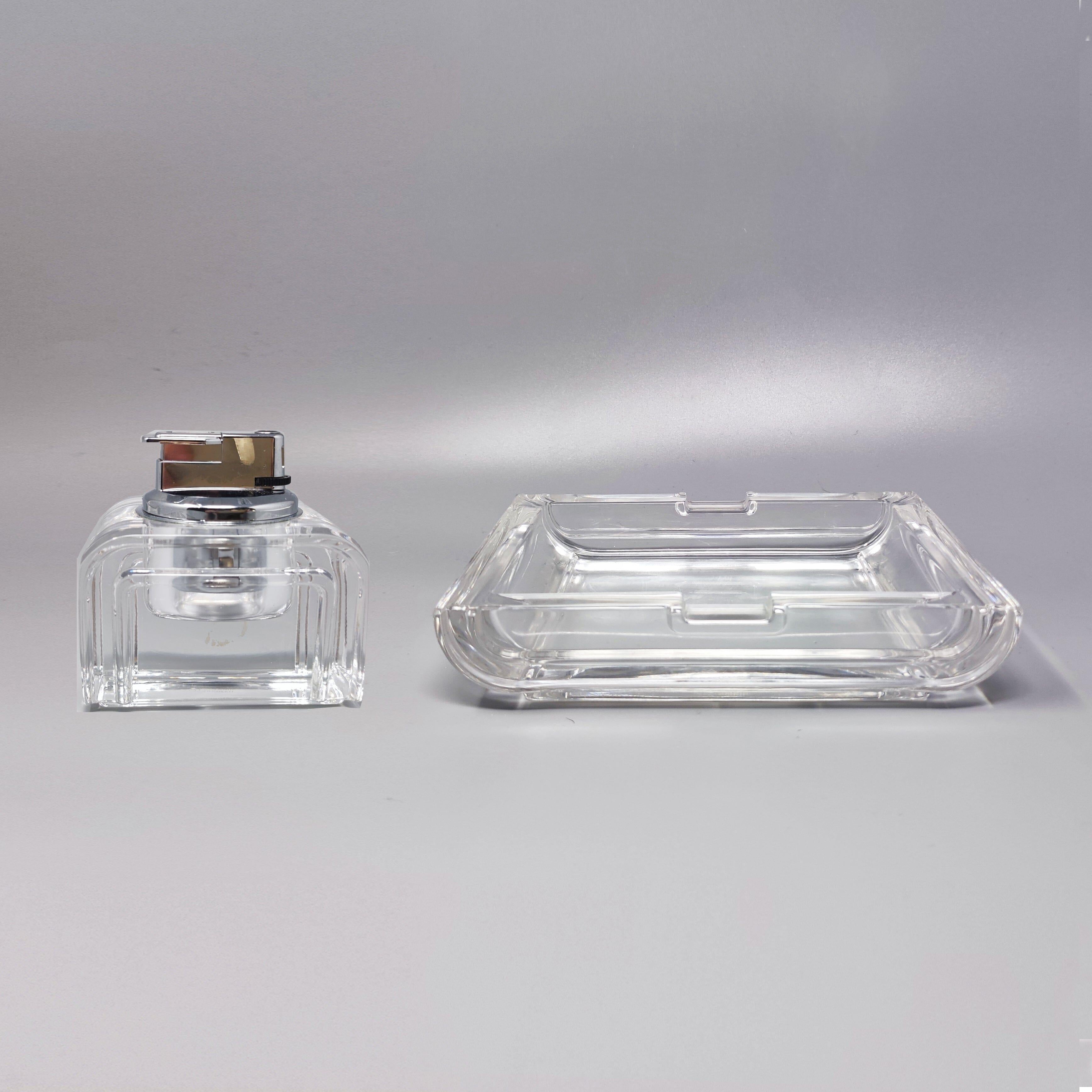 1970s Stunning smoking set in crystal by Laura Griziotti for Arnolfo di Cambio. Made in Italy. The items are in excellent condition. The table lighter works perfectly. This smoking set is gorgeous. It's signed at the bottom.
Dimension:
Ashtray