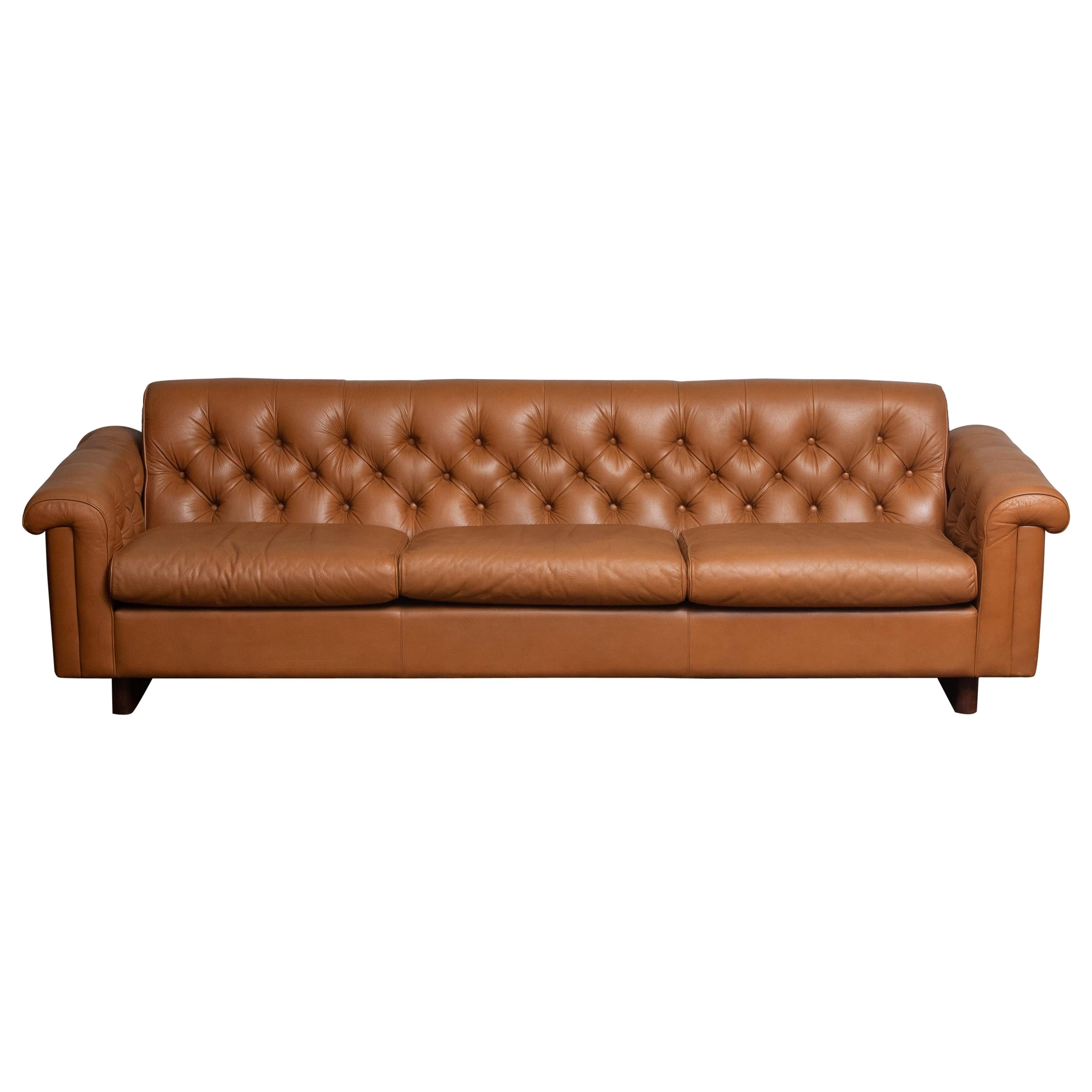 Absolutely rare and beautiful ( Chesterfield model ) sofa in camel color tufted leather from the second half of the 70's designed by Karl Erik Ekselius for JOC Design Vetlanda in Sweden. (Labeled)
This sofa feels soft and sits extremely