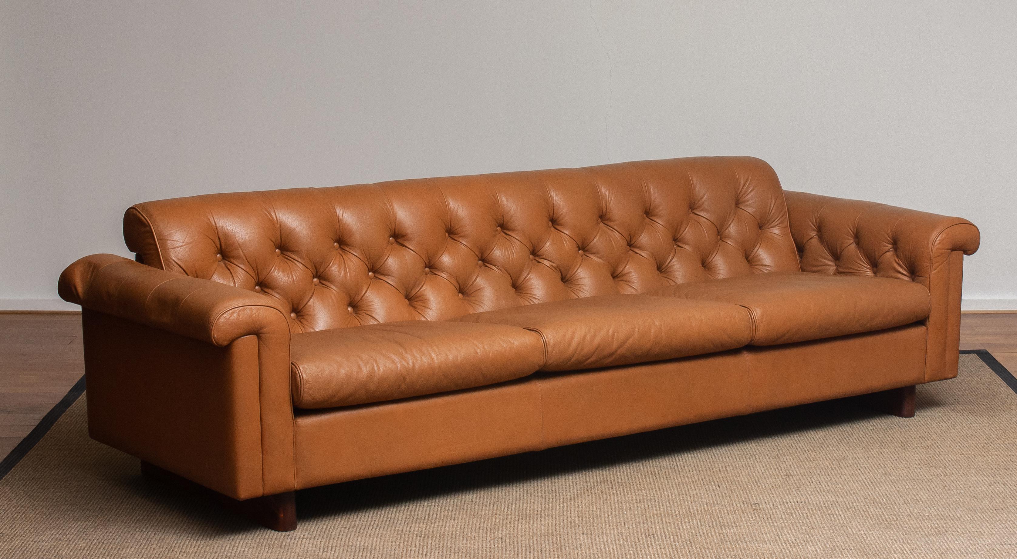 Absolutely rare and beautiful (Chesterfield model) sofa in camel color tufted leather from the second half of the 70's designed by Karl Erik Ekselius for JOC Design Vetlanda in Sweden. (Labeled)
This sofa feels soft and sits extremely comfortable.