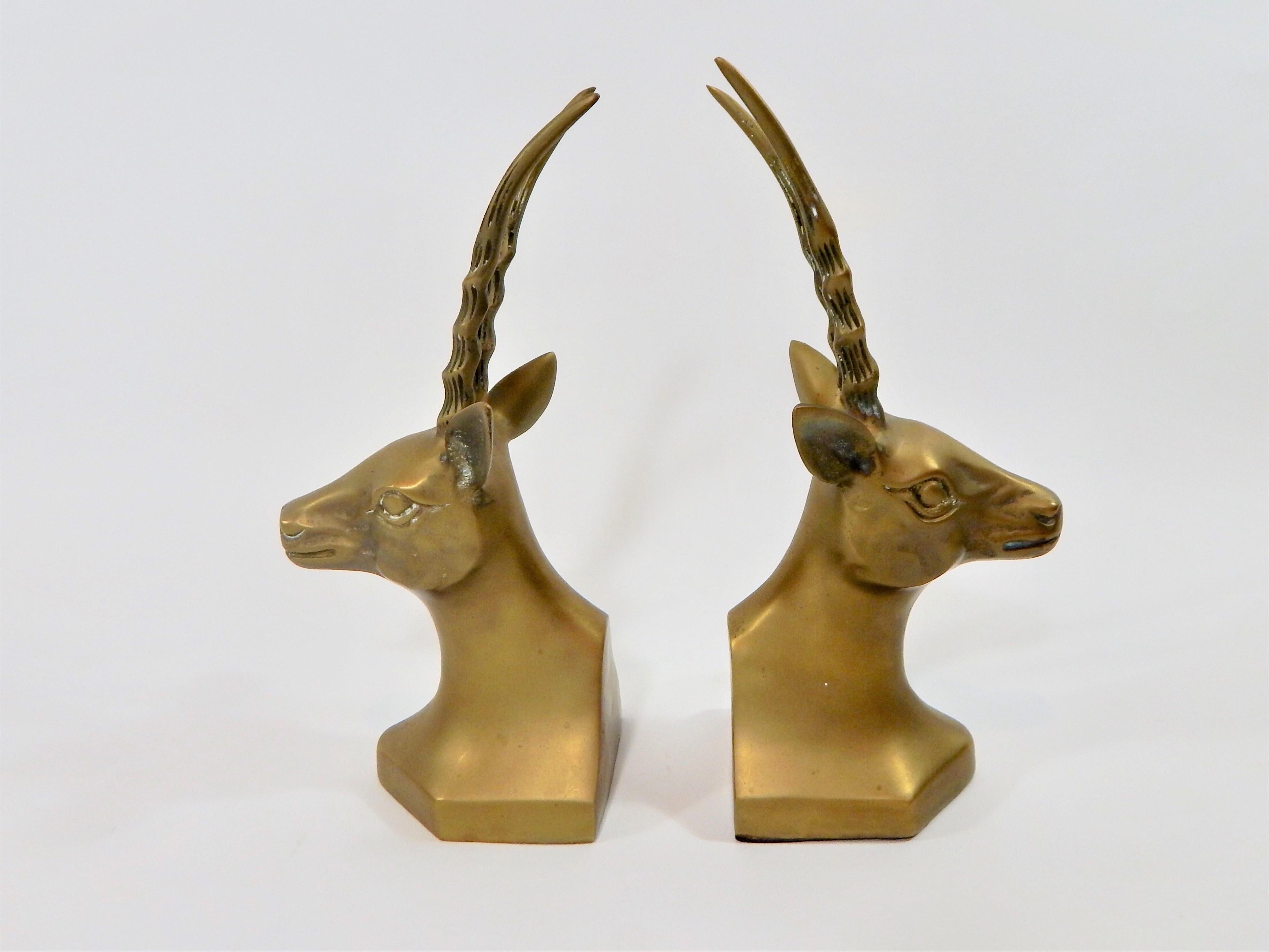 1970s solid brass antelope or gazelle bookends. Nice patina on brass. Felt on bottom.
 
