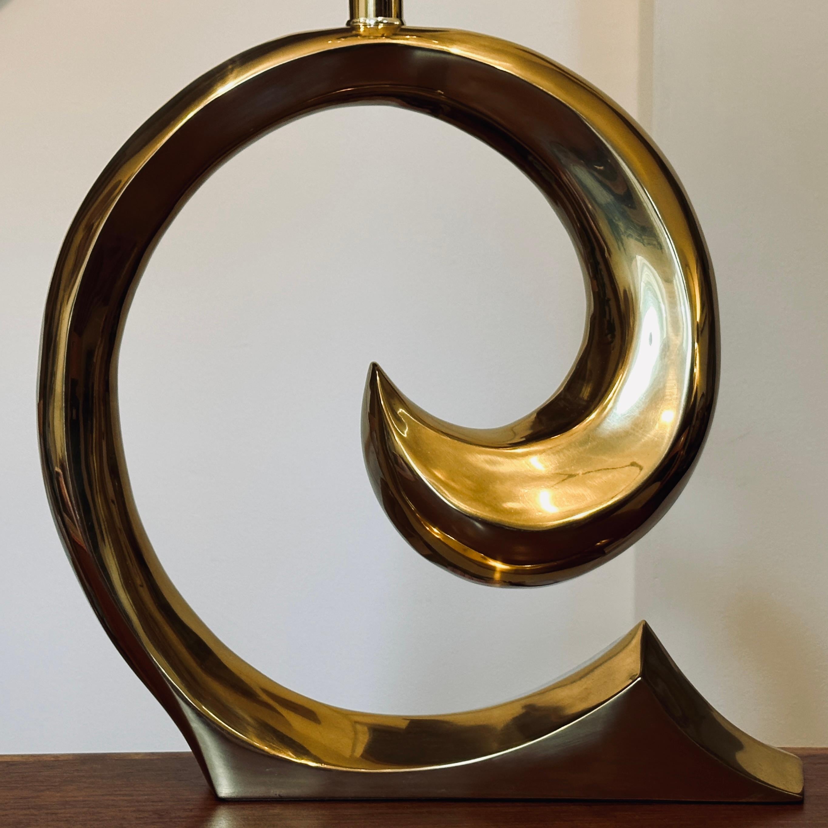 Amazing statement table lamp in a sculptural wave form designed by Erwin Lambeth with the original patent design number label intact to the left of the cord hole. Often attributed to Pierre Cardin. The footprint of the felted base measures roughly
