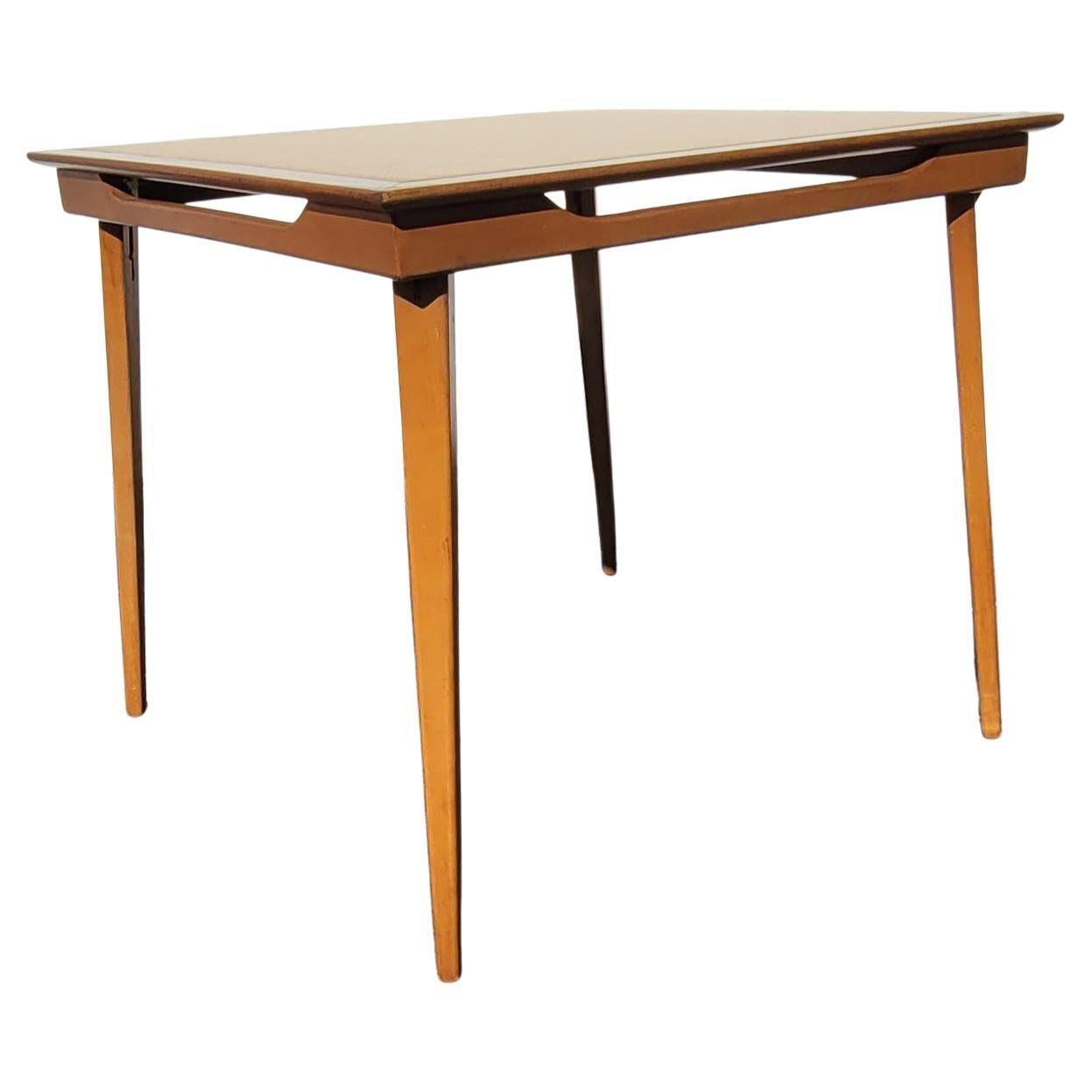 A 1970s solid maple with Leatherette top folding card table. 
Tan maple finish with almond color Leatherette top. 
Folding mechanism functions perfectly. 
Measures 32.5:W x 32.5