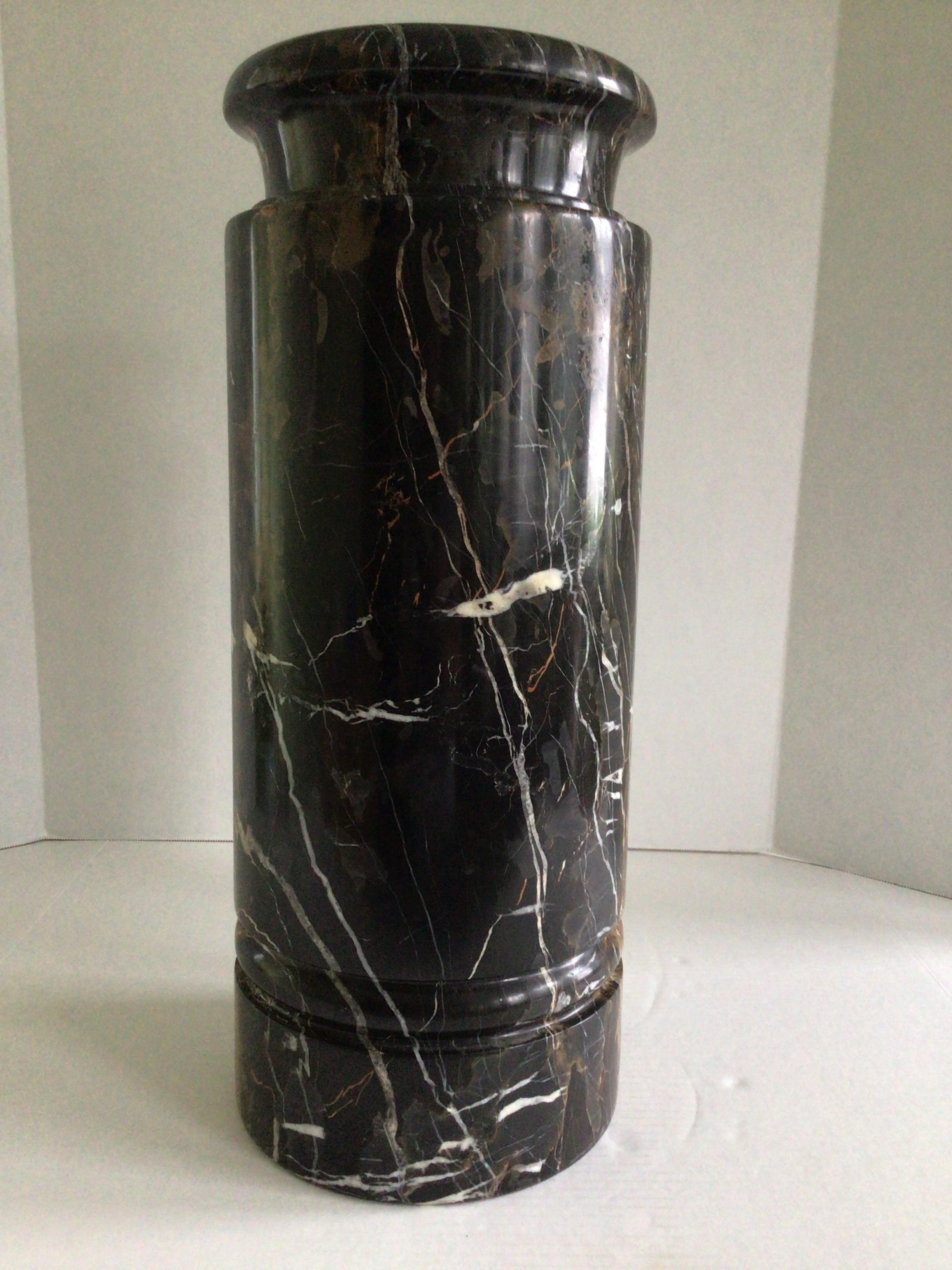 1970s Solid Natural Marble Umbrella Stand
Typically, marble elements of this caliber can only be found in the finest antique ateliers of Europe. Perfect for stately shafts of umbrellas, riding crops, or walking sticks
This marble vessel is a study