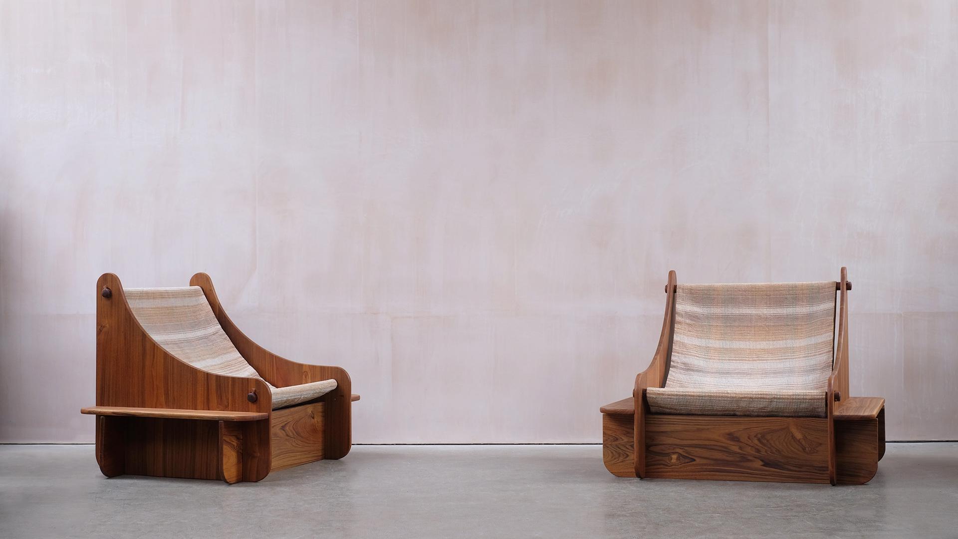 Amazing pair of solid teak lounge chairs designed and made in Hyderabad, India 1970’s. Low and wide and with a heavy cotton sling seat, the chairs are super cool and comfortable too. Very high quality and super original chairs.