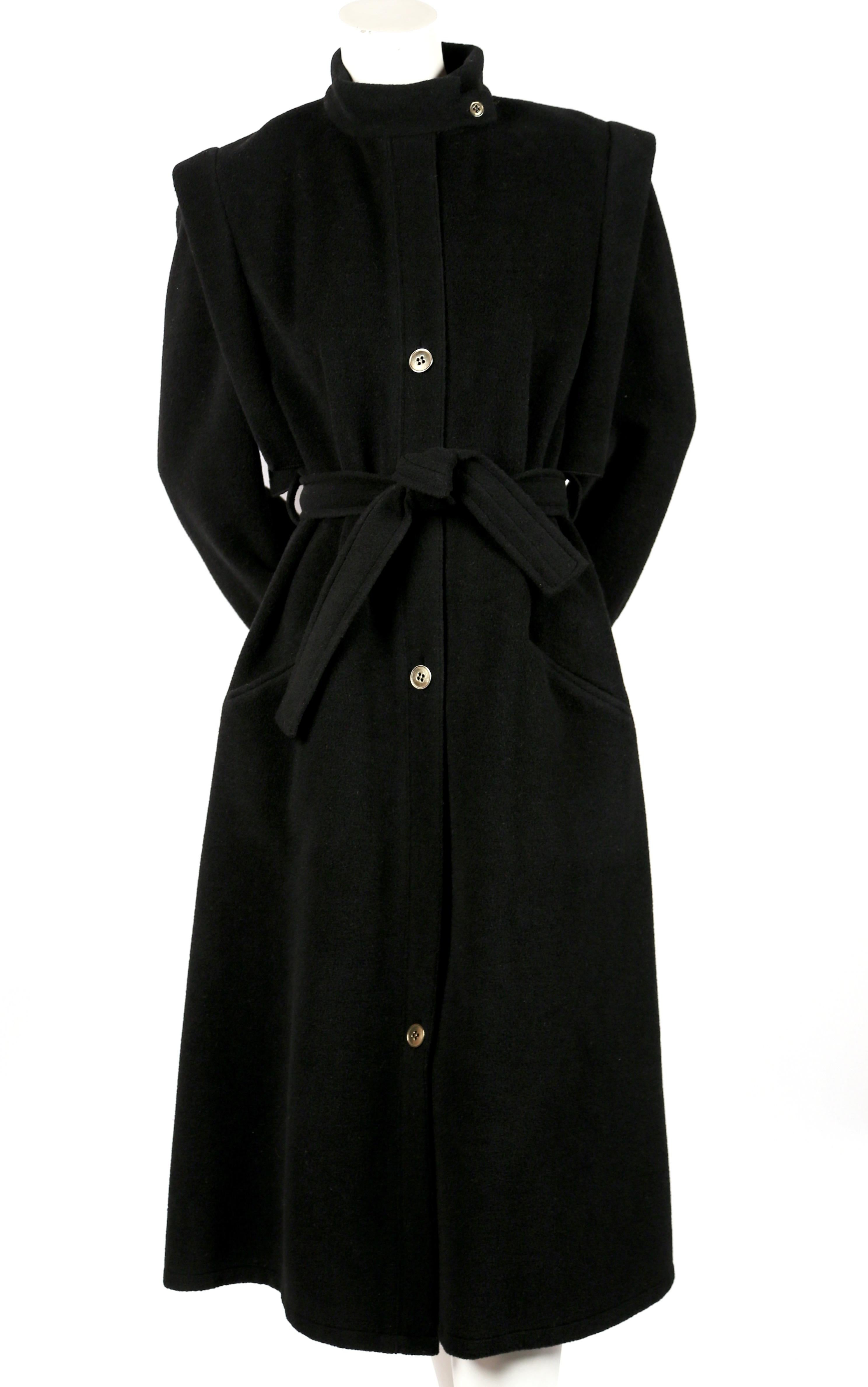 Uniquely shaped, black wool coat with structured shoulders and metal buttons designed by Sonia Rykiel for Henri Bendel. No size is indicated however this would fit a size 2-6 depending on fit. For reference, the coat was photographed on a size 2