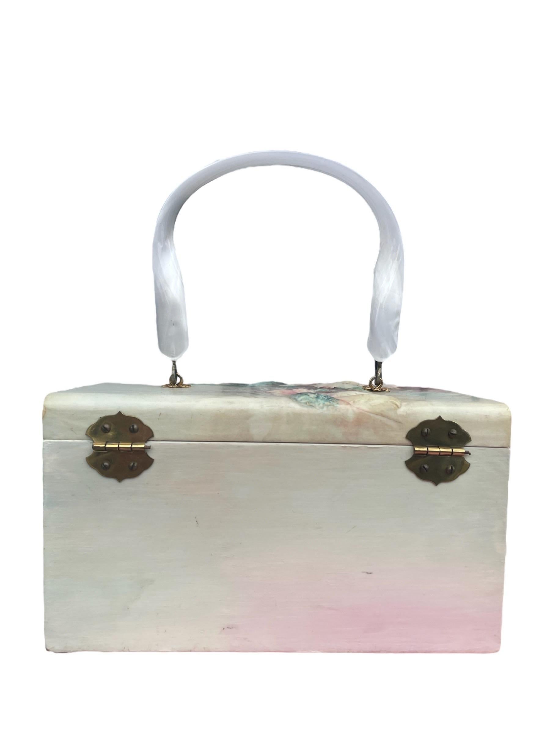 1970s Sonie Ames Rose Painted and Textured Box Purse 

Height: 4.5”
Width:  8”
Depth: 5”

Length of Handle: 12”

Very Good Vintage Condition! 