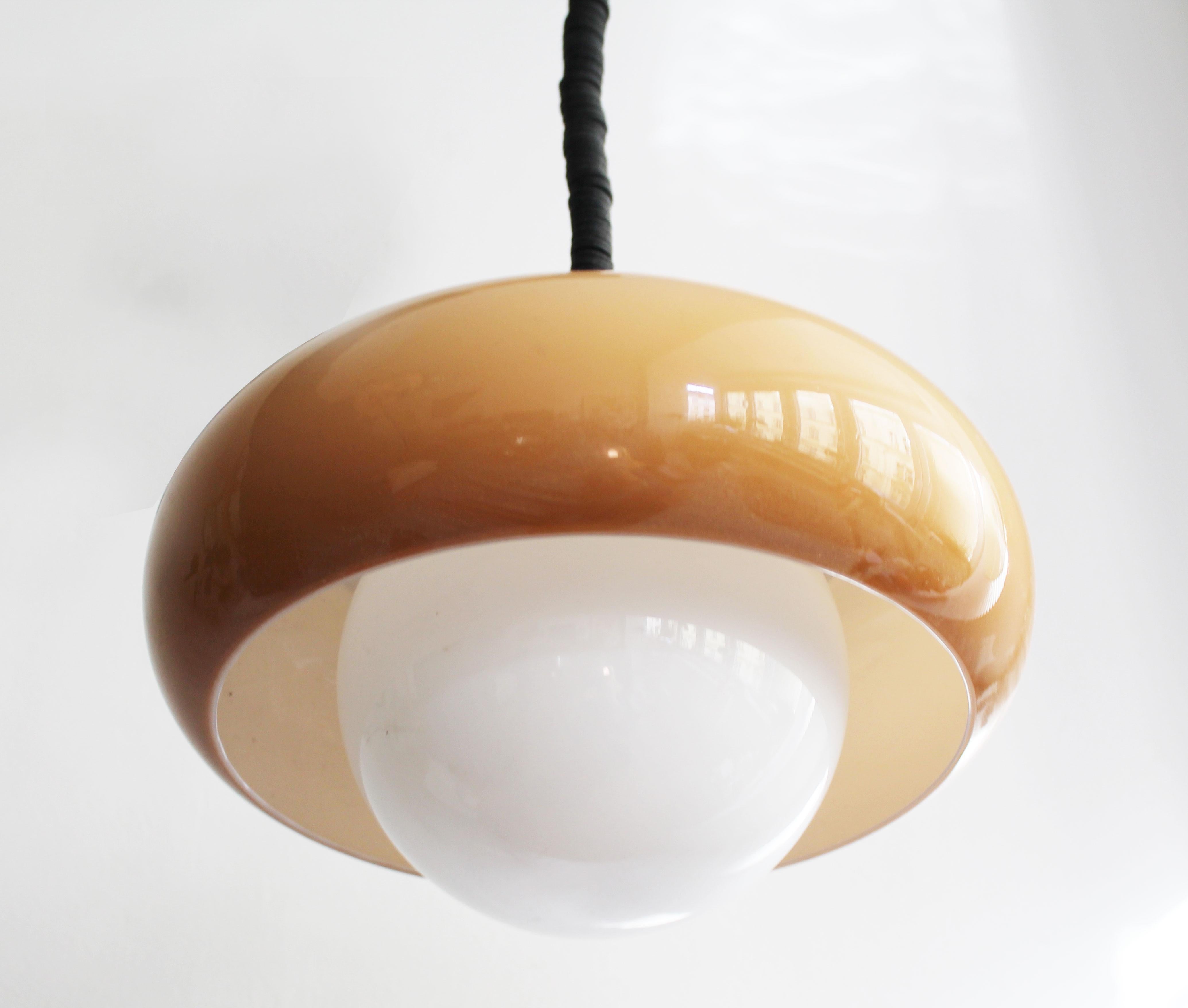 This is an original ceiling lamp designed by Guzzini brothers and produced by their namesake company during the 1970’s.

Guzzini company was originally founded in 1959 by Raimondo Guzzini and at that time it focused purely on producing decorative