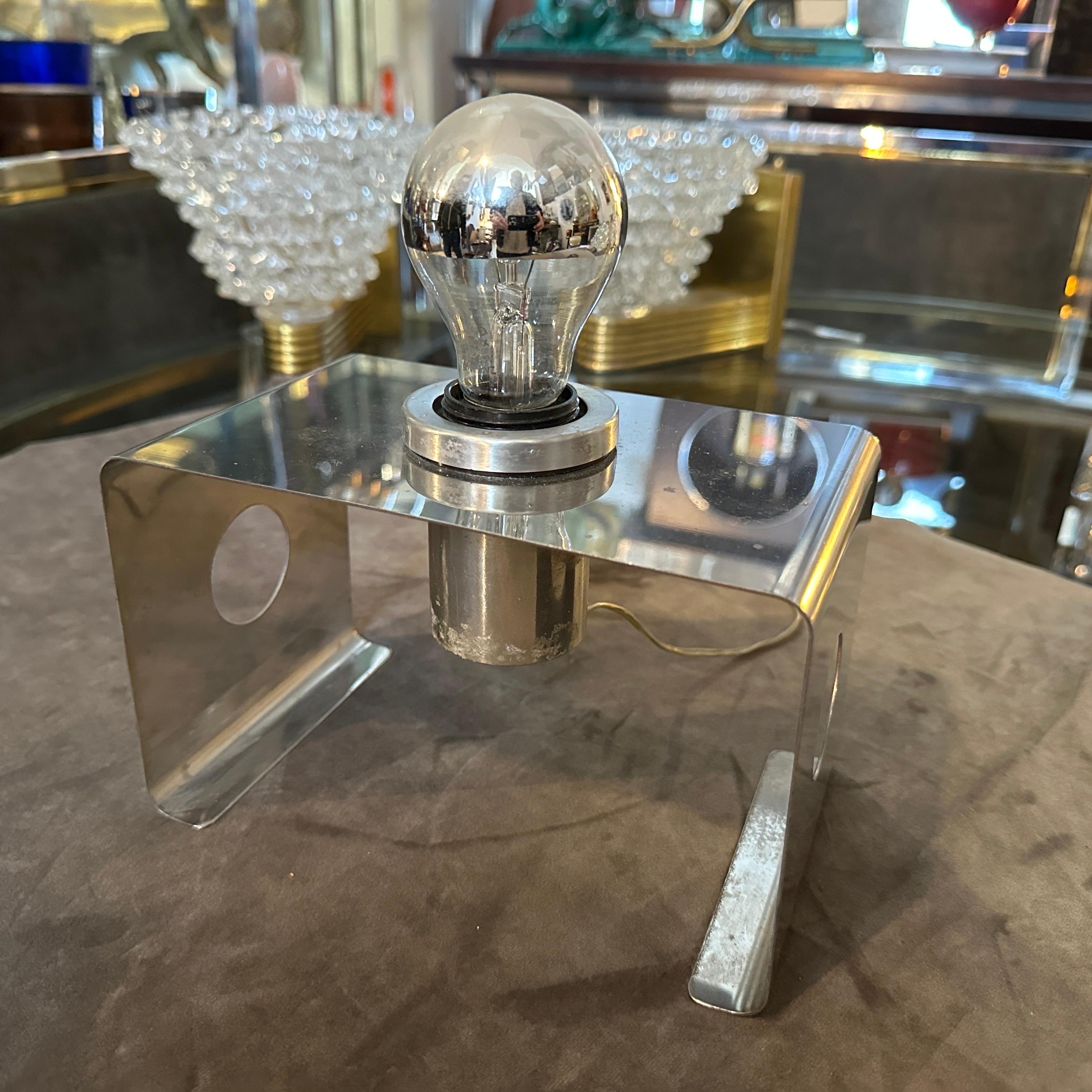 This Italian Table Lamp embodies the era’s playful yet forward-thinking approach to design. Its bold geometry and minimalist aesthetic are hallmark traits of Space Age and modernist lighting designs from Italy during that time. The lamp features a