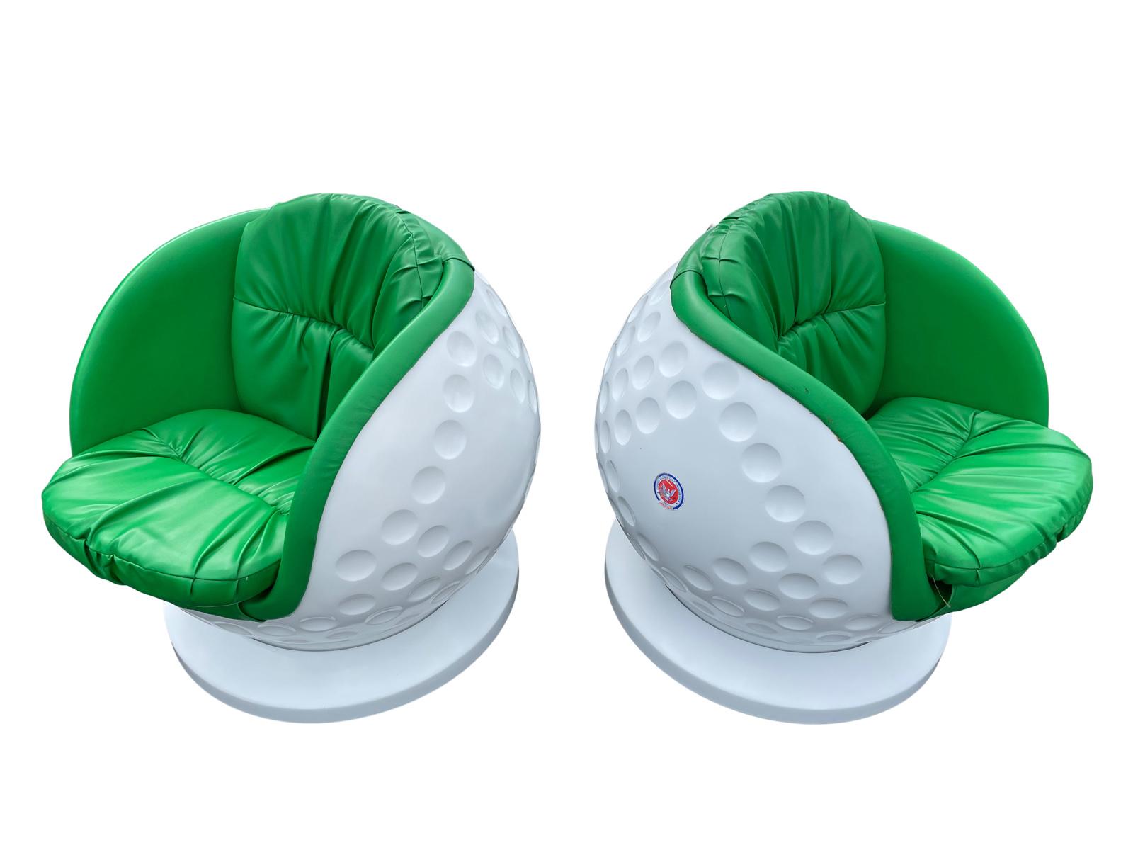 Very unique pair of fiberglass Molded lounge chairs in the shape of golf balls. These were acquired from a PGA tour in the 1970s I believe in Oklahoma.