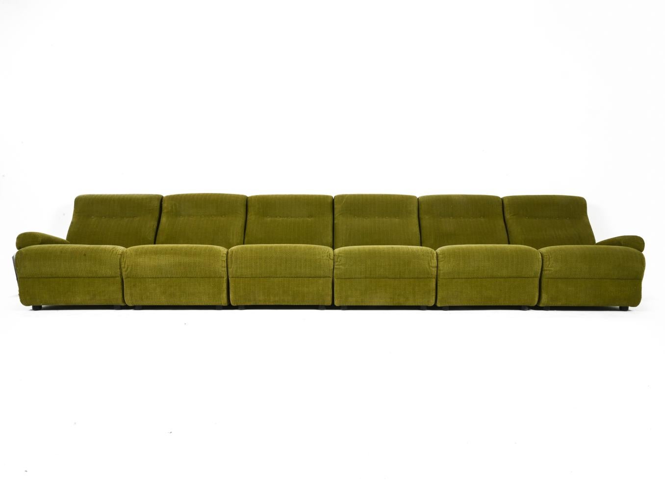 Turn your living space into a retro-futuristic installation with this fabulous Space Age modular sofa. The chunky, plinth-style silhouette is pure 1970's fun; with four armless sections and two single-arm endpieces, you are free to craft the perfect