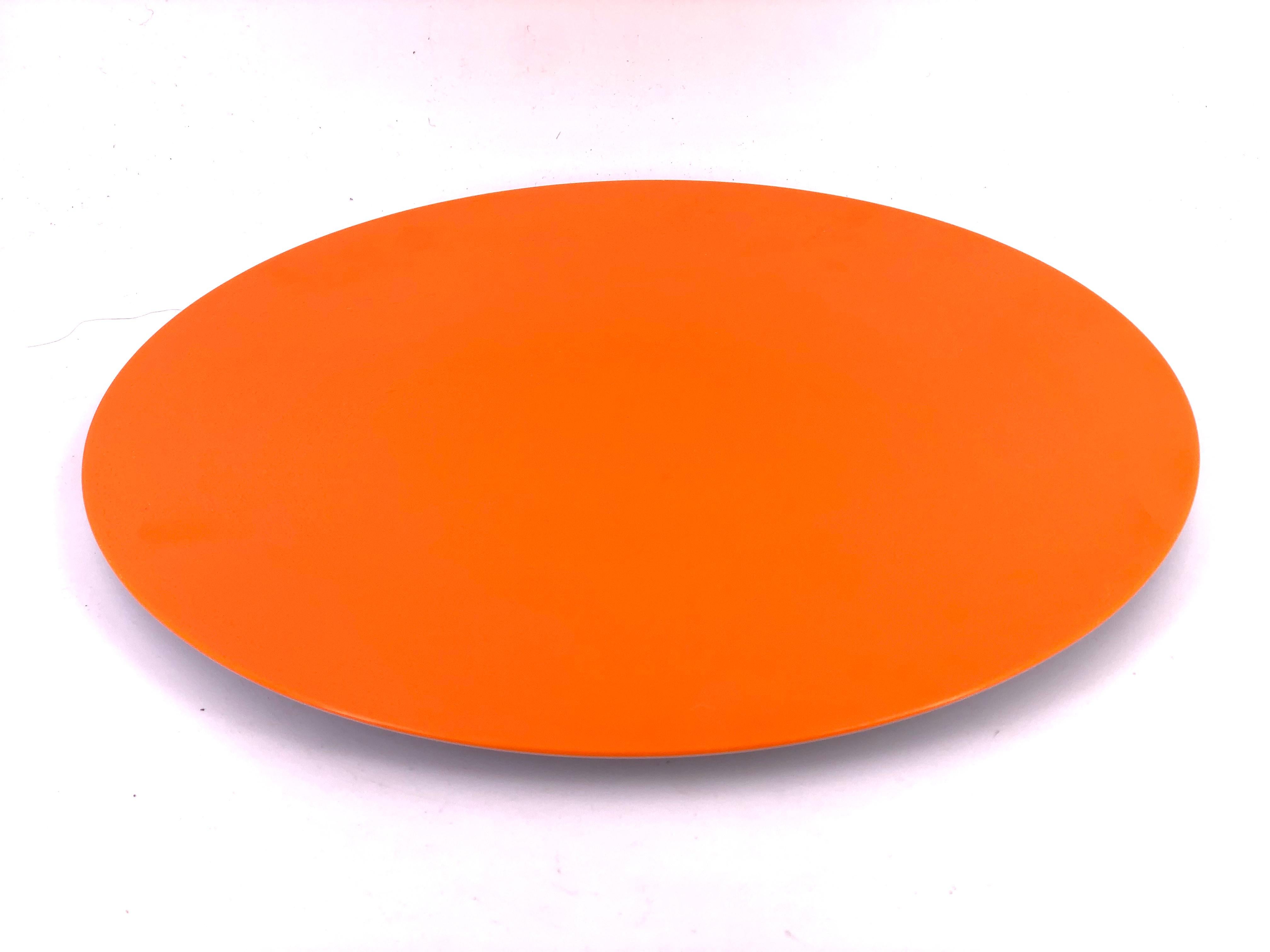 A cool large orange centerpiece orange large plate, circa 1970s in nice orange melamine great centerpiece we have 2 available buyers has the choice to buy 1 or 2.