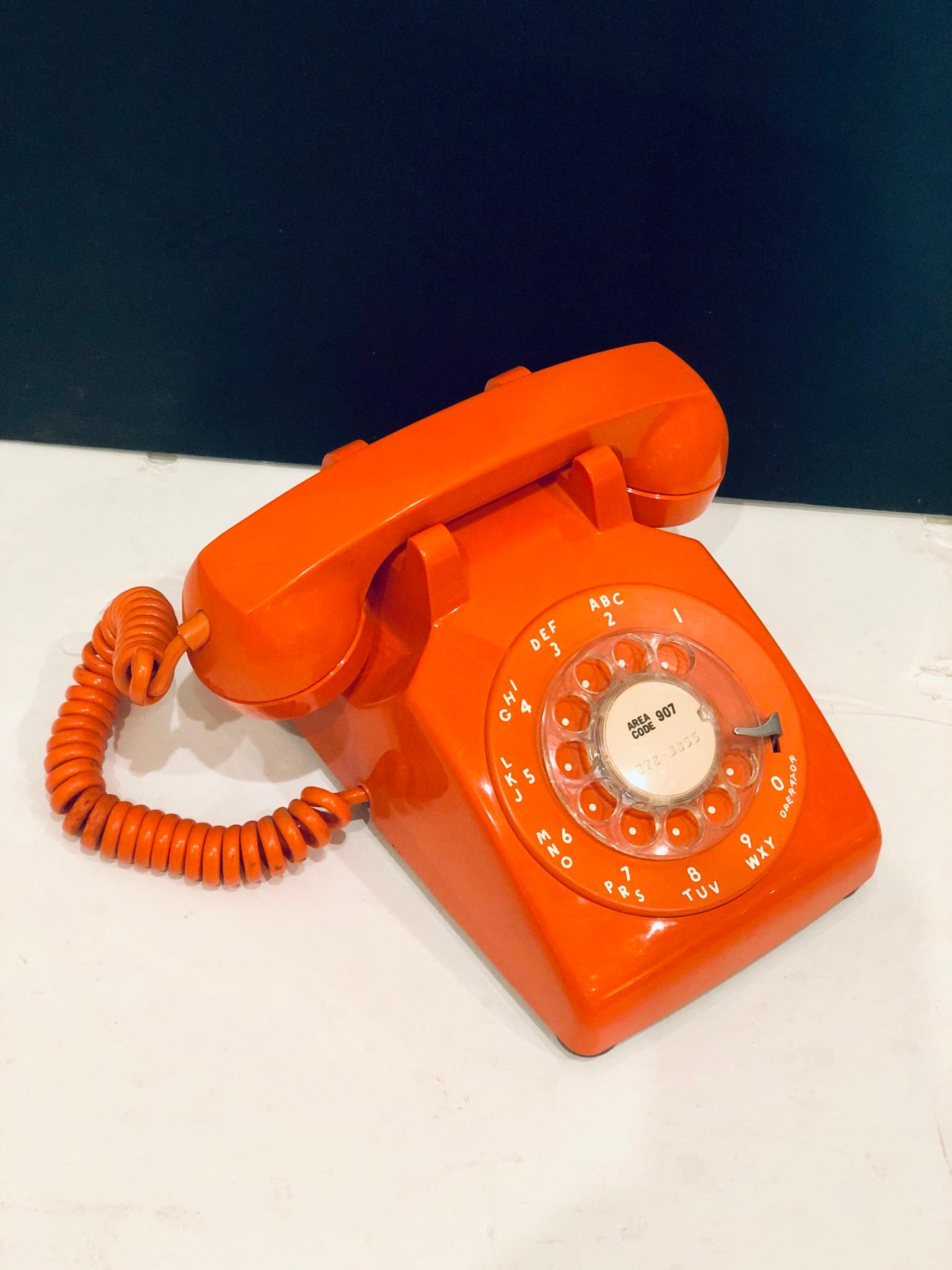 Cool and in working condition 1970's orange rotary phone made by ITT, great clean condition and working with adaptor for new wall plugs.
