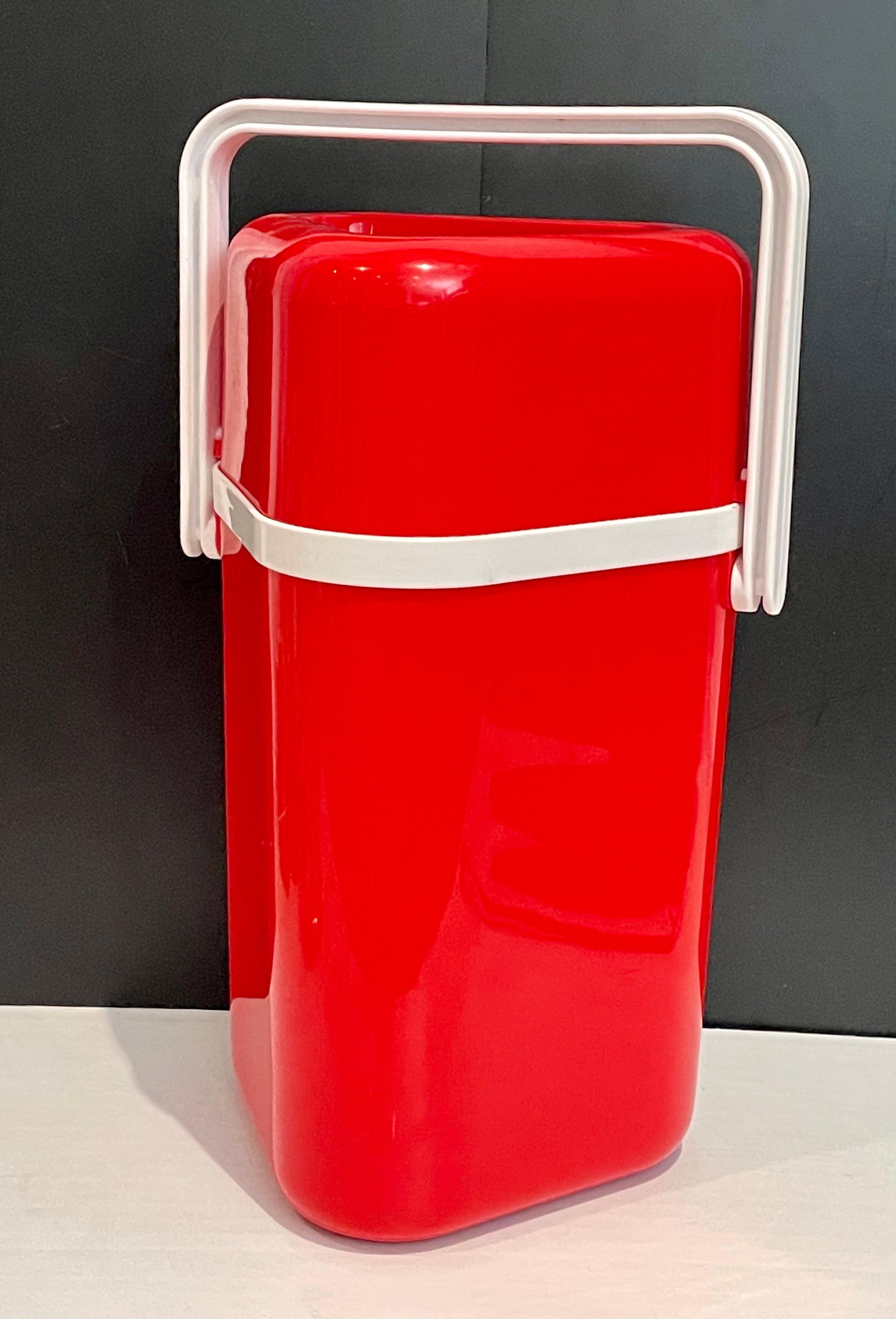 Insulated wine carrier with wine chiller was designed in 1978 to meet the needs of people in Melbourne Australia who patronized 'BYO' (bring your own) restaurants, which was a popular practice at this time. It can also be used as a bottle drink