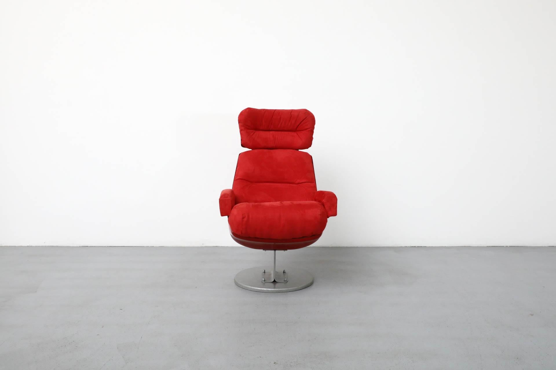 French, Space Age, Mid-Century lounge chair which was remarkably reclaimed from a 1970's Parisian cinema and upholstered in gorgeous red fabric. The lacquered fiberglass frame has some chipping and cracking to its sides and the aluminum accents and