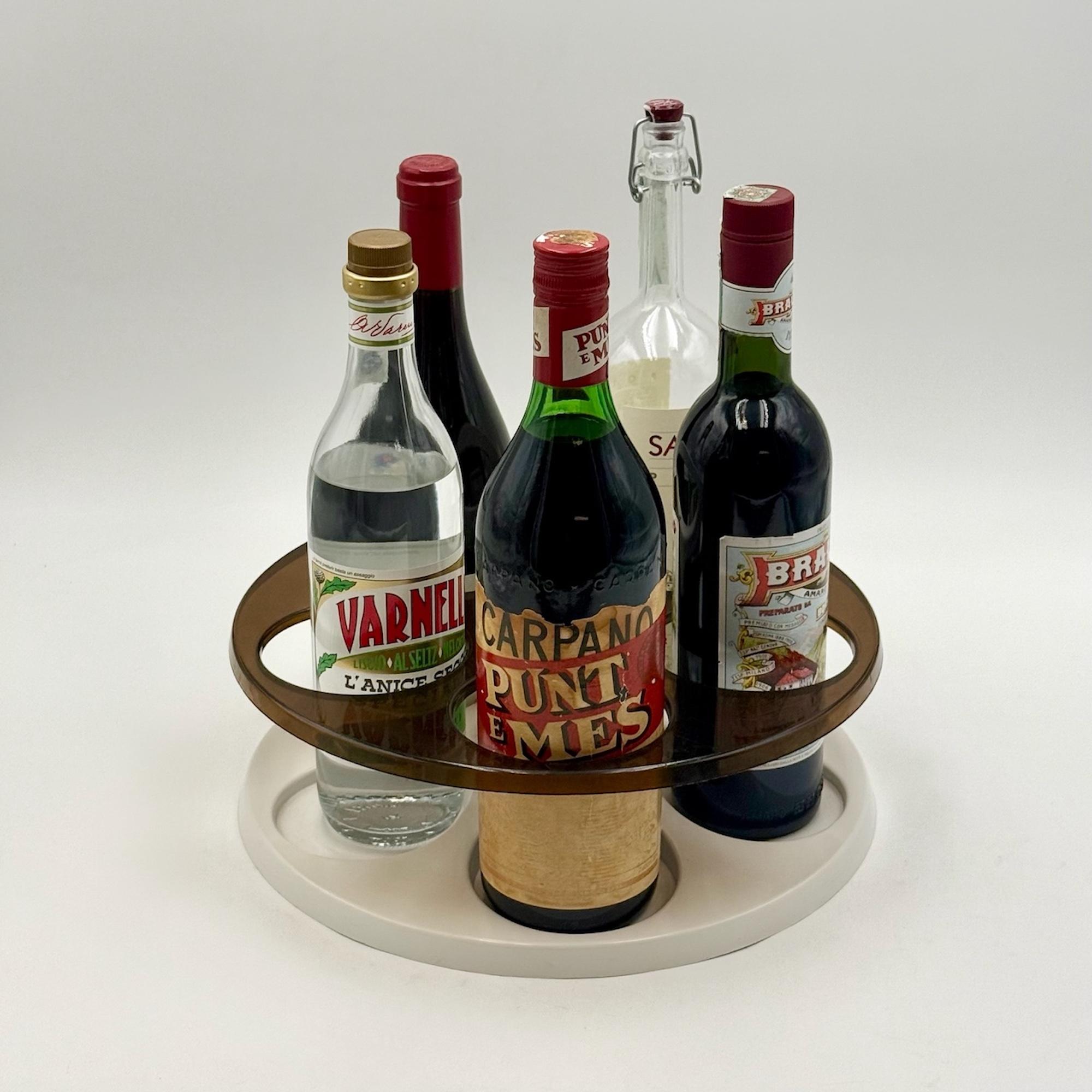 This Space Age rotating bottle holder is a playful and sculptural piece of Dutch design, made in Holland in the 1970s. With its bold circular geometry and smooth rotating base, it exemplifies the futuristic aesthetic of the era.

The structure