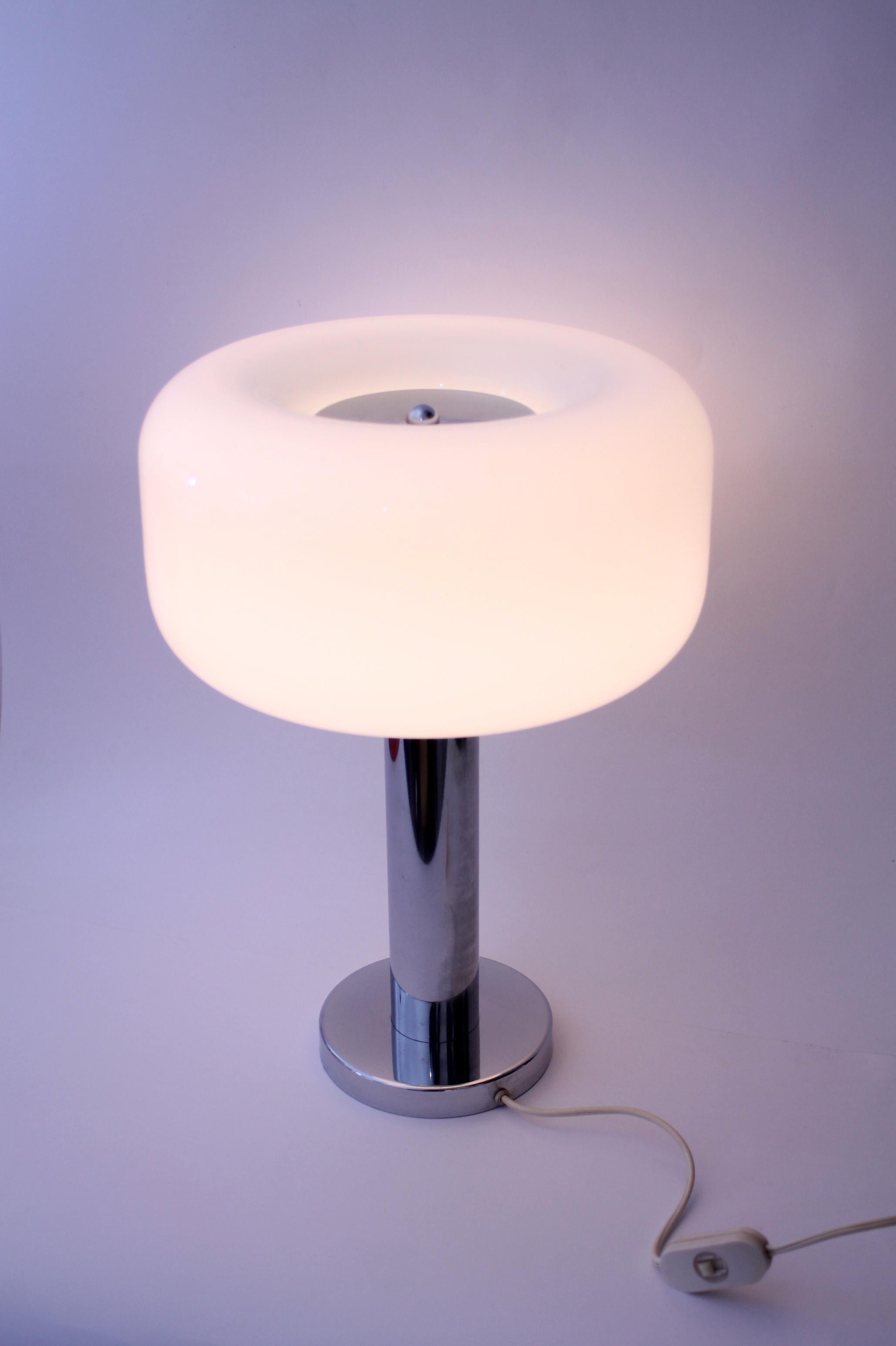 1970s Space age desk/table lamp glass. Super cool mid-century piece!
Opaline glass lampshade with steel chromed heavy base. 

Dimensions: Ø 28cm x 40cm height
Weight: 7kgs (14 pounds circa)
Condition: Gently used, near mint with no visible cracks or