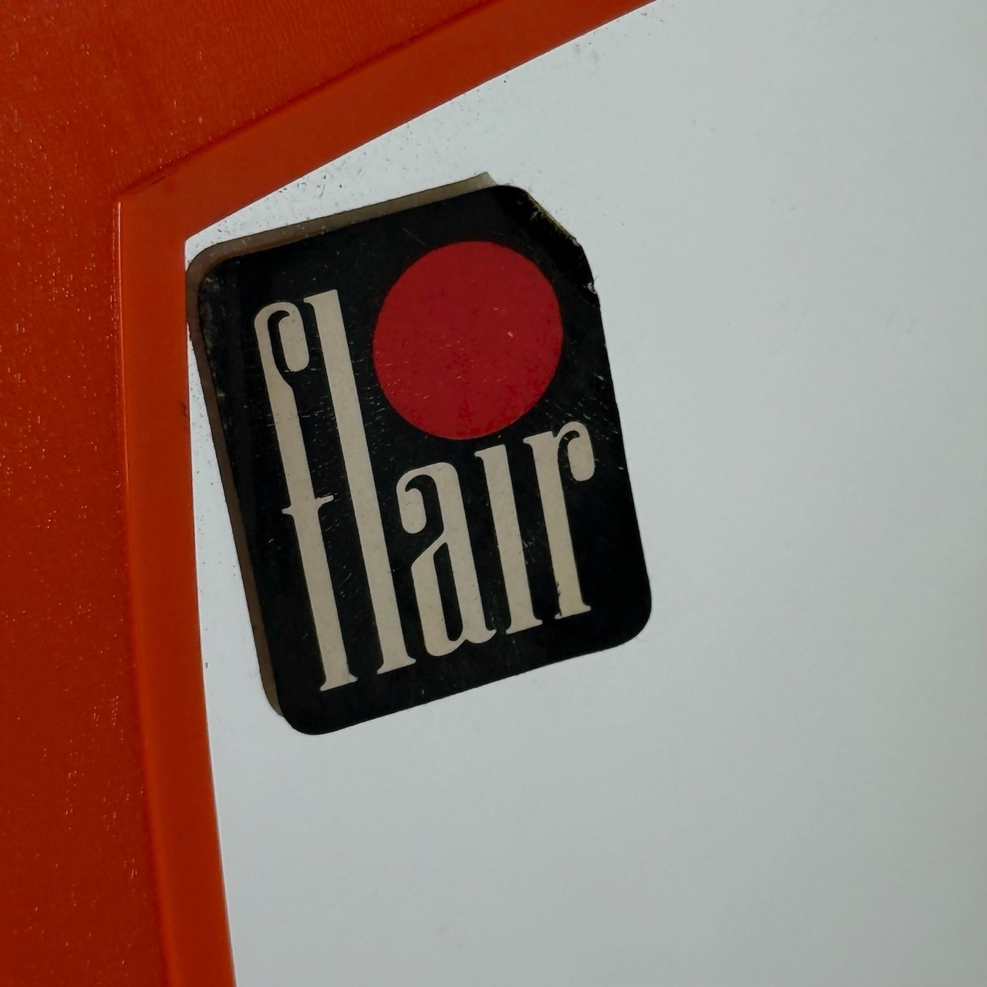 Offered here is a rare and complete 1970s Space Age vanity set designed by Flair in Holland. Characterized by its compact, modular design and dynamic color contrast, the piece is made from glossy molded plastic in white, with original orange