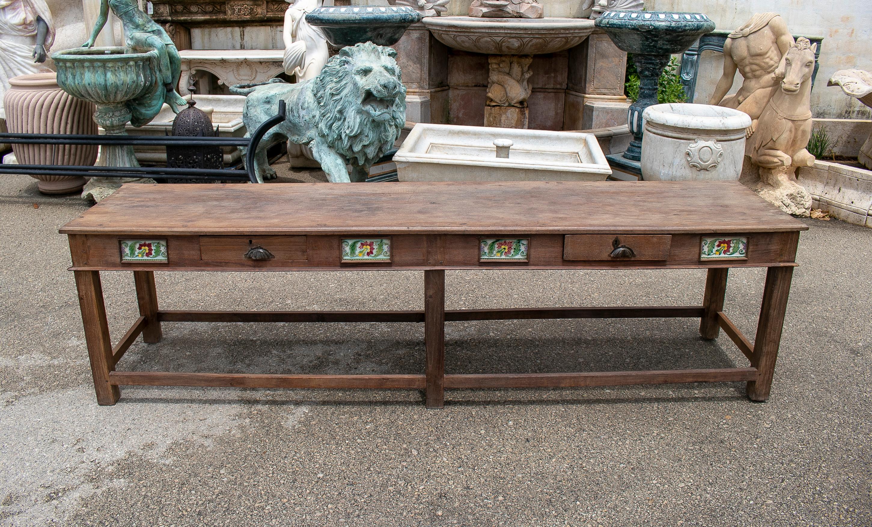 Rustic 1970s Spanish 2-drawer natural wood farmhouse table with glaze tiles.