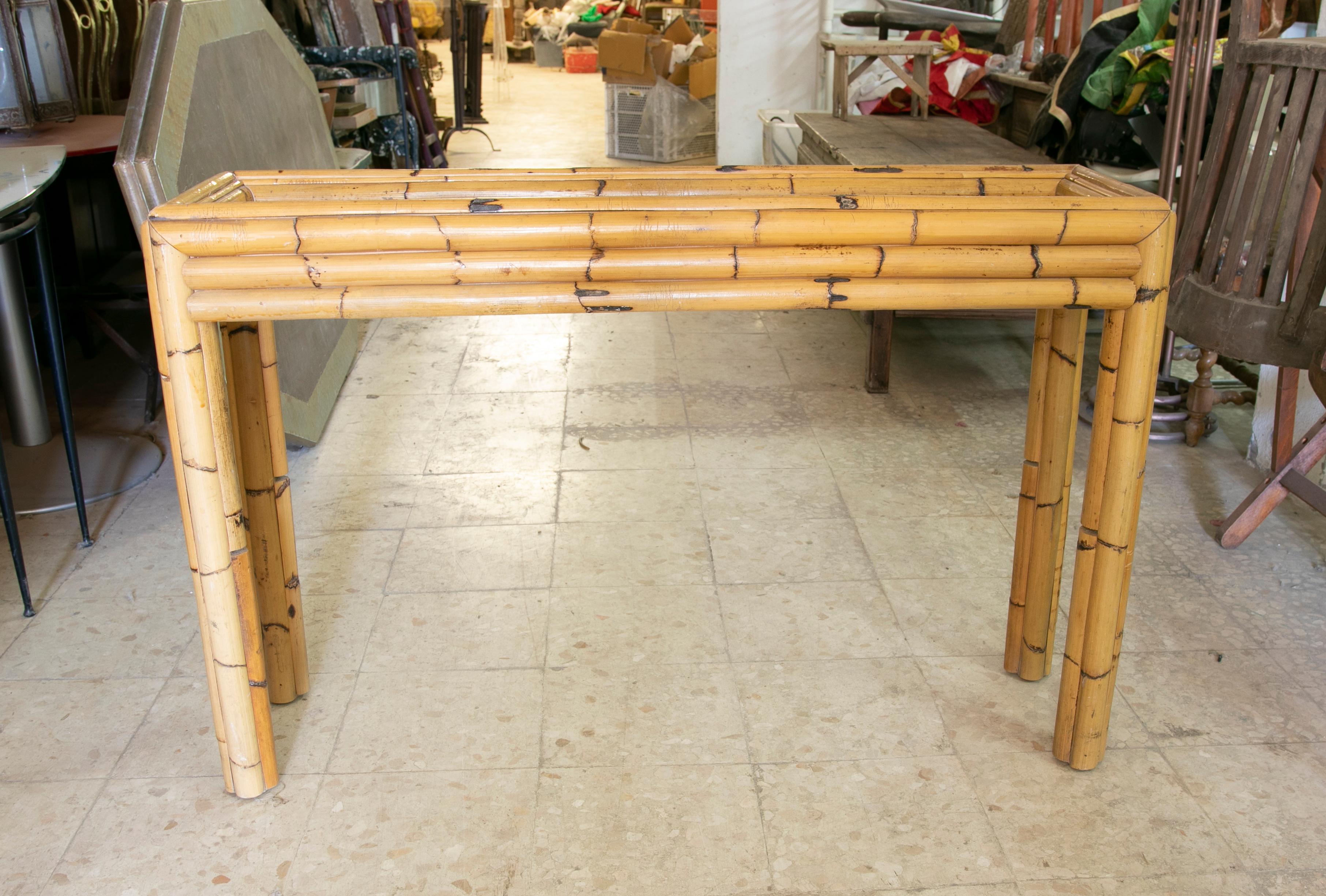 1970s Spanish bamboo console with a glass top (included in the price).
 