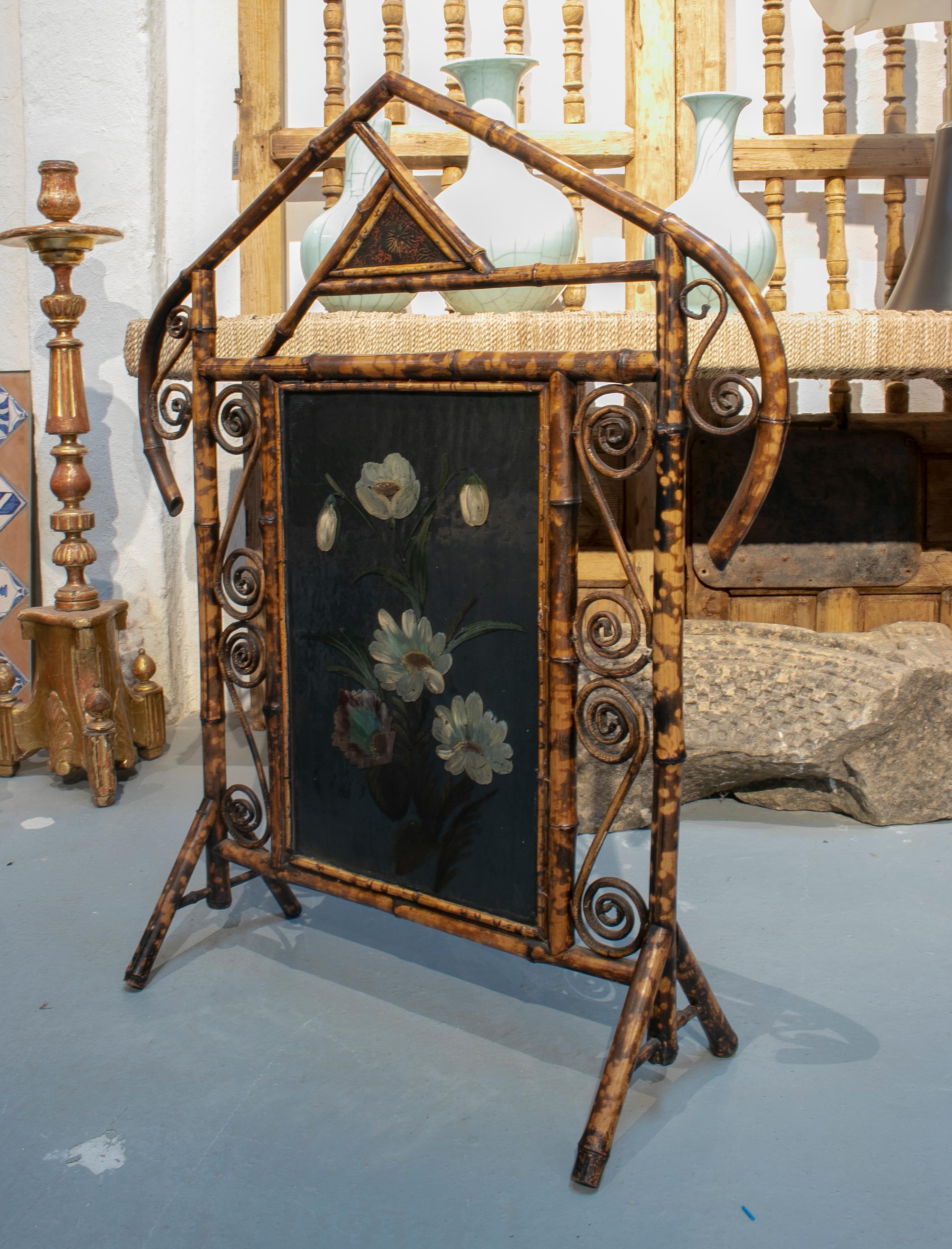 1970s Spanish bamboo fire screen with flower painting.