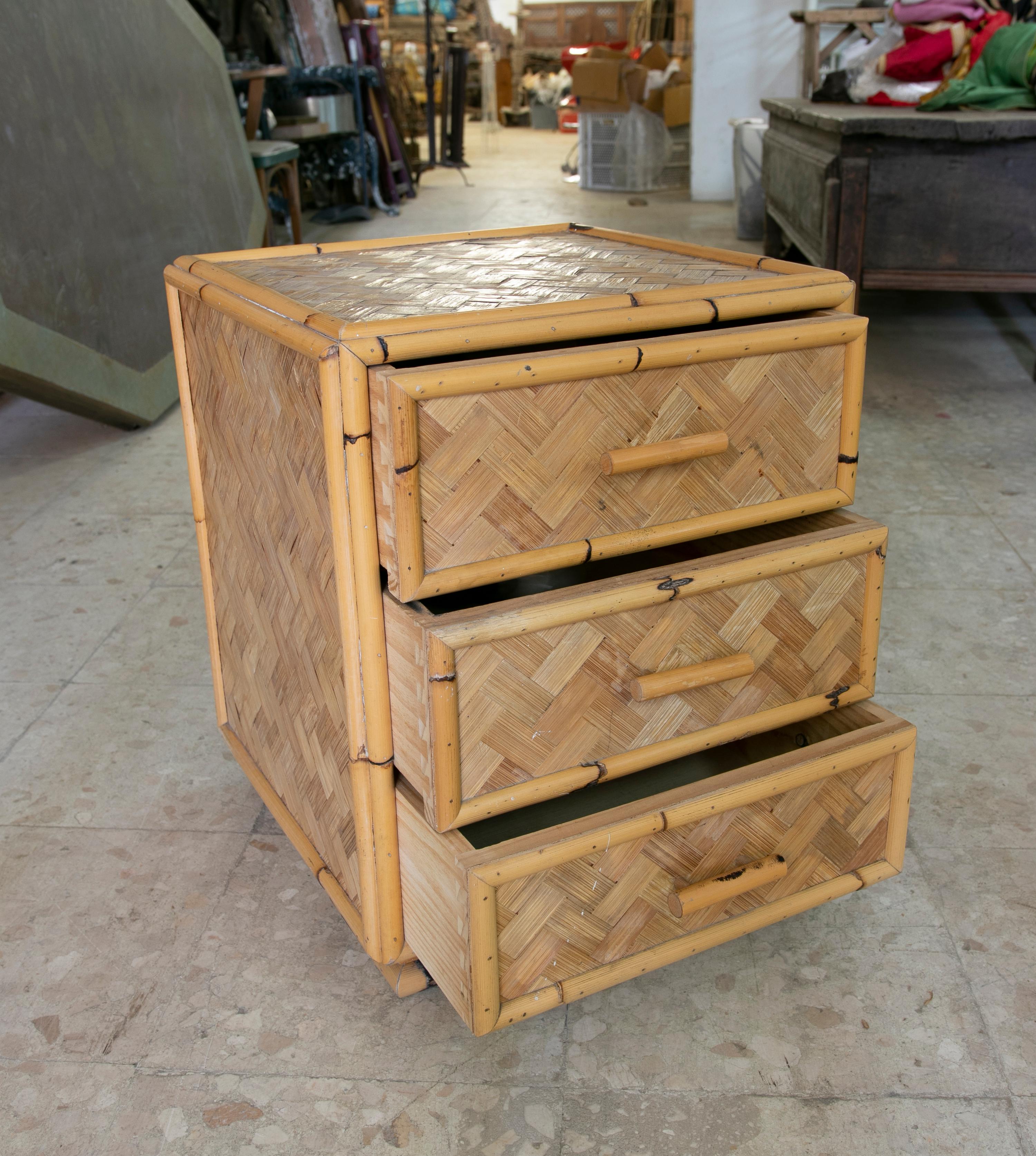 1970s Spanish bamboo sidetable with three drawers.