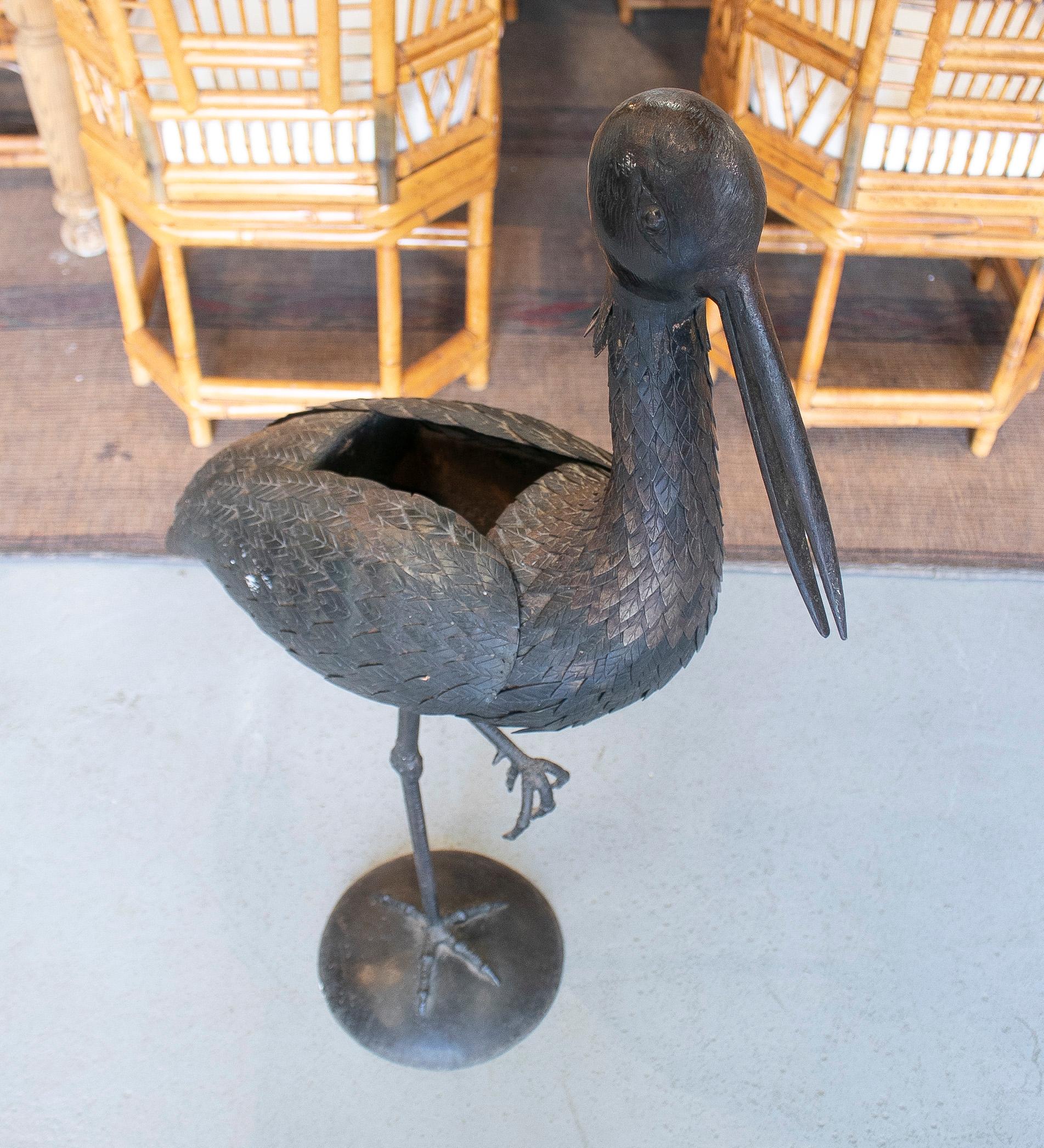 1970s Spanish bronze heron figure sculpture with wings that open up to access the hollow interior.