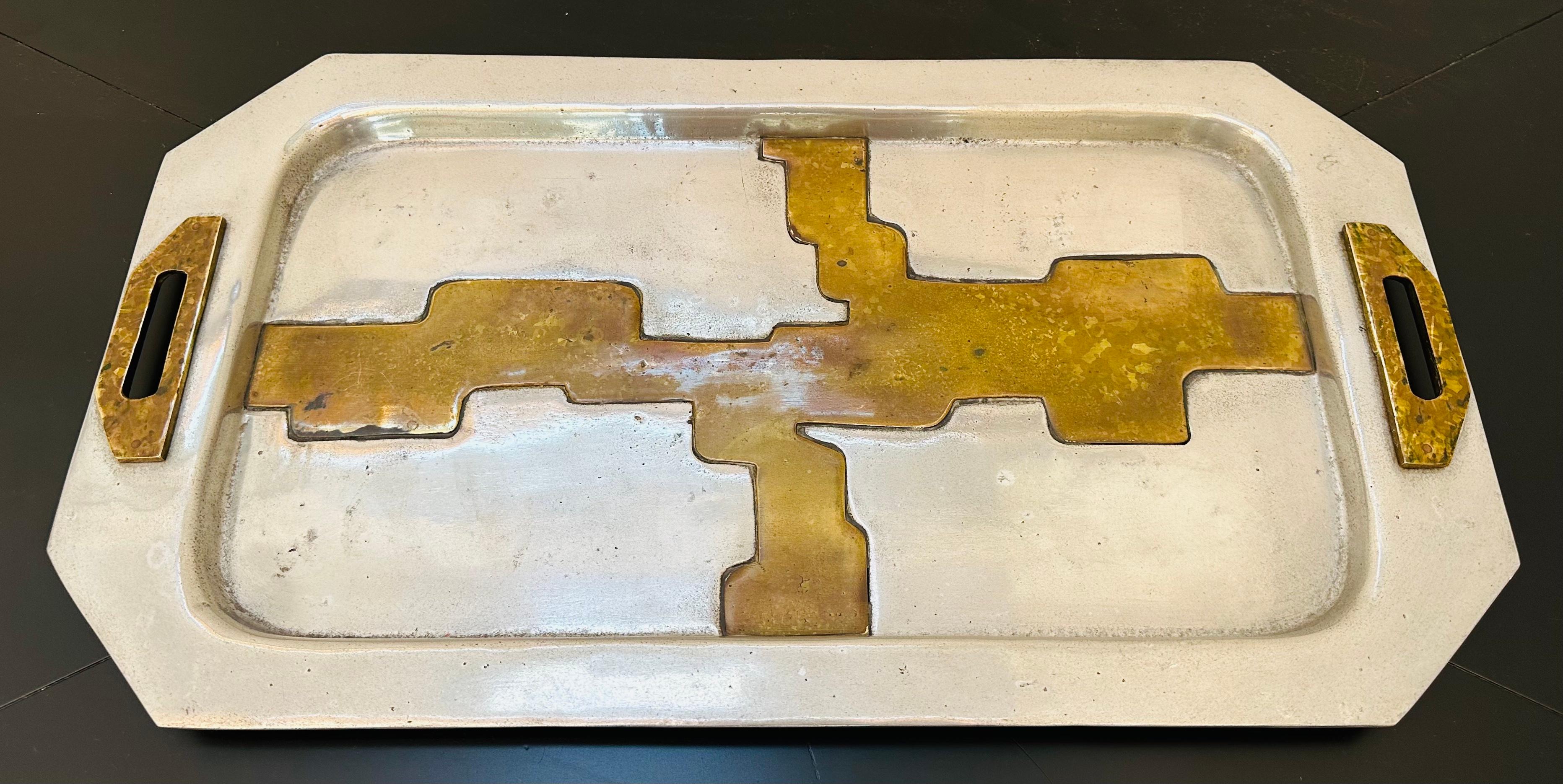 1970s Spanish aluminium & brass brutalist serving tray designed in the style of  Scottish artist David Marshall.  The brass is inlaid in an abstract design across the aluminium with matching raised brass handles.  The underneath of the tray has been