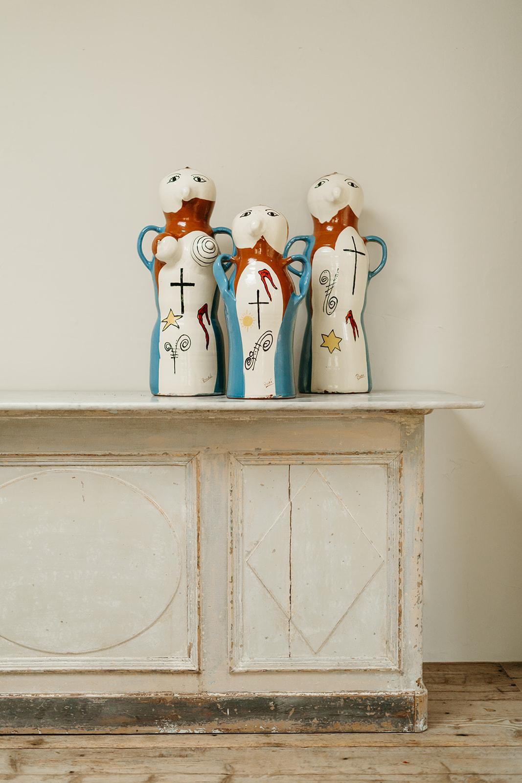 the family ! rare to find these 3 Buxo vases together .. 
decorative fun objects that will bring a smile to your face ..
mama 67 cm high x 30 cm wide and 28 cm deep
papa 67 cm high x 32 cm wide and 23 cm deep 
baby 54 cm high x 28 cm wide and 23 cm