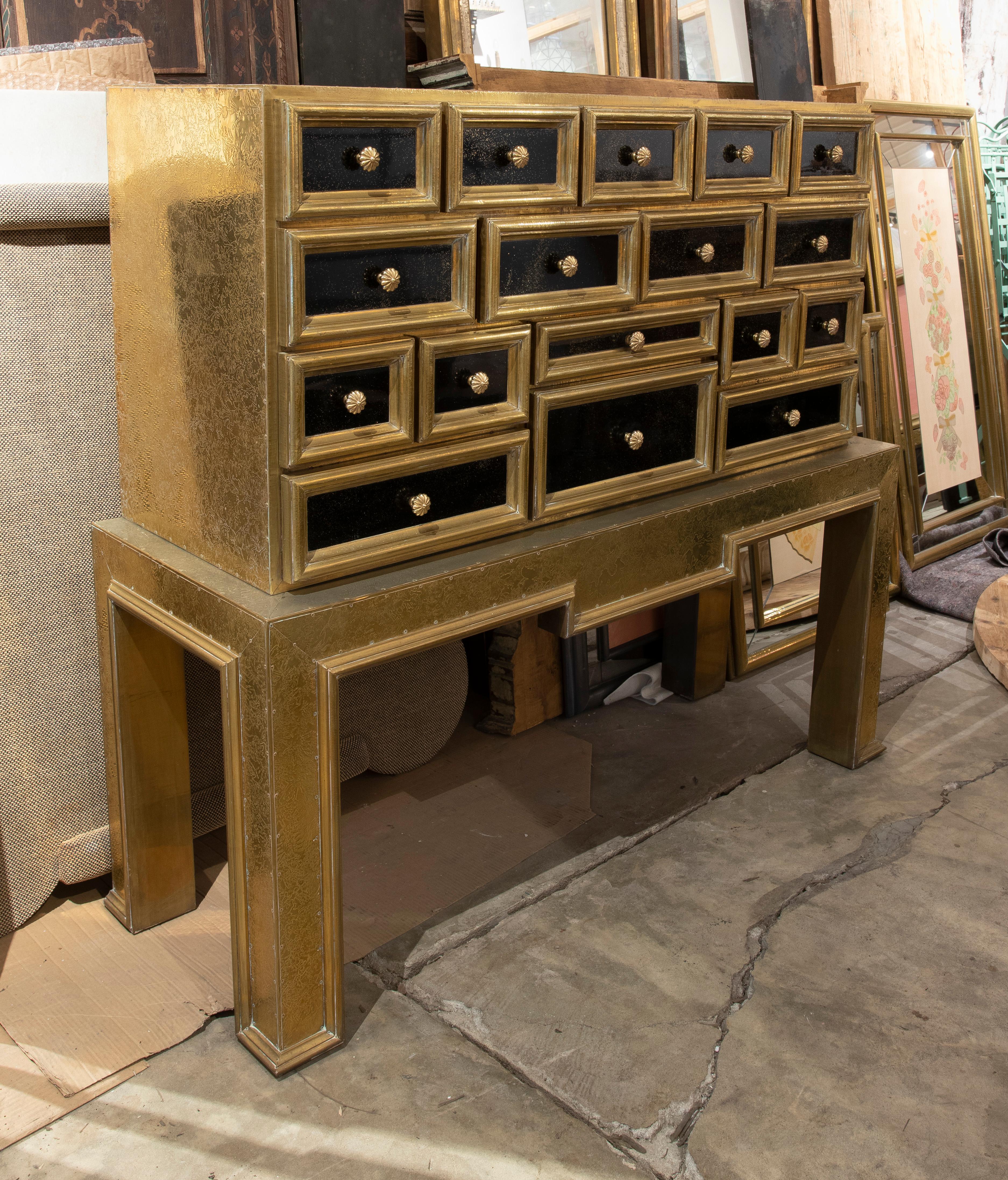 Spanish bargueño with wooden frame and covered in brass, with drawers, flower-shaped handles, 1970's.