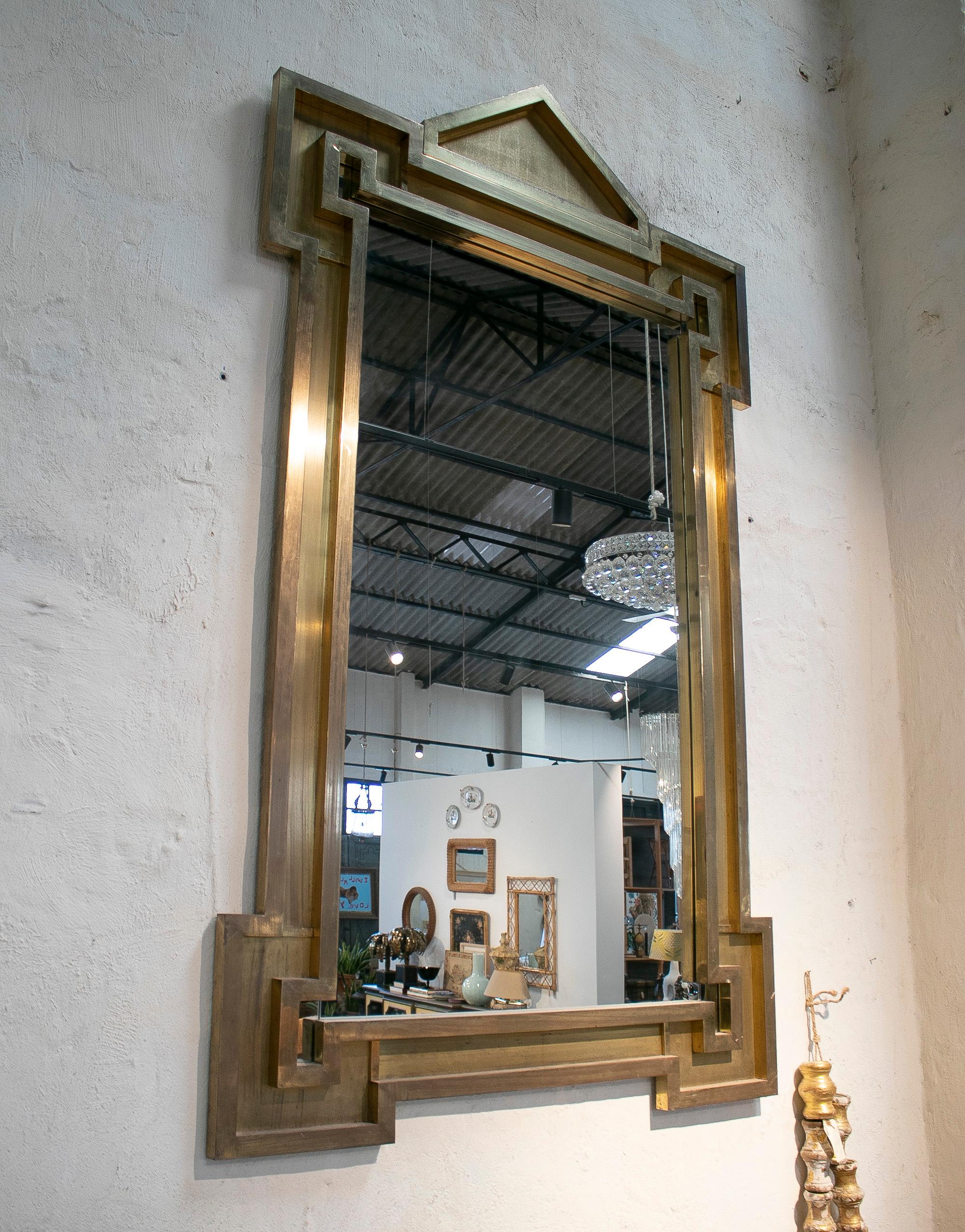 Vintage 1970s Spanish classical brass wall mirror.