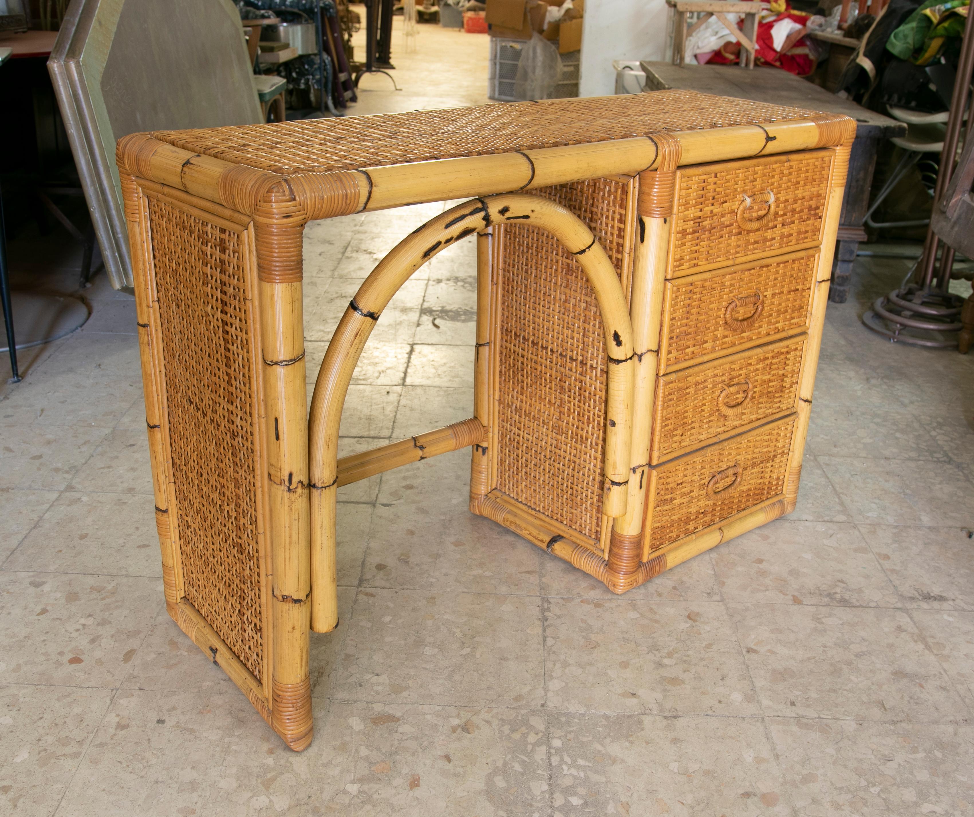 1970s Spanish desk made of bamboo and wicker with four drawers.