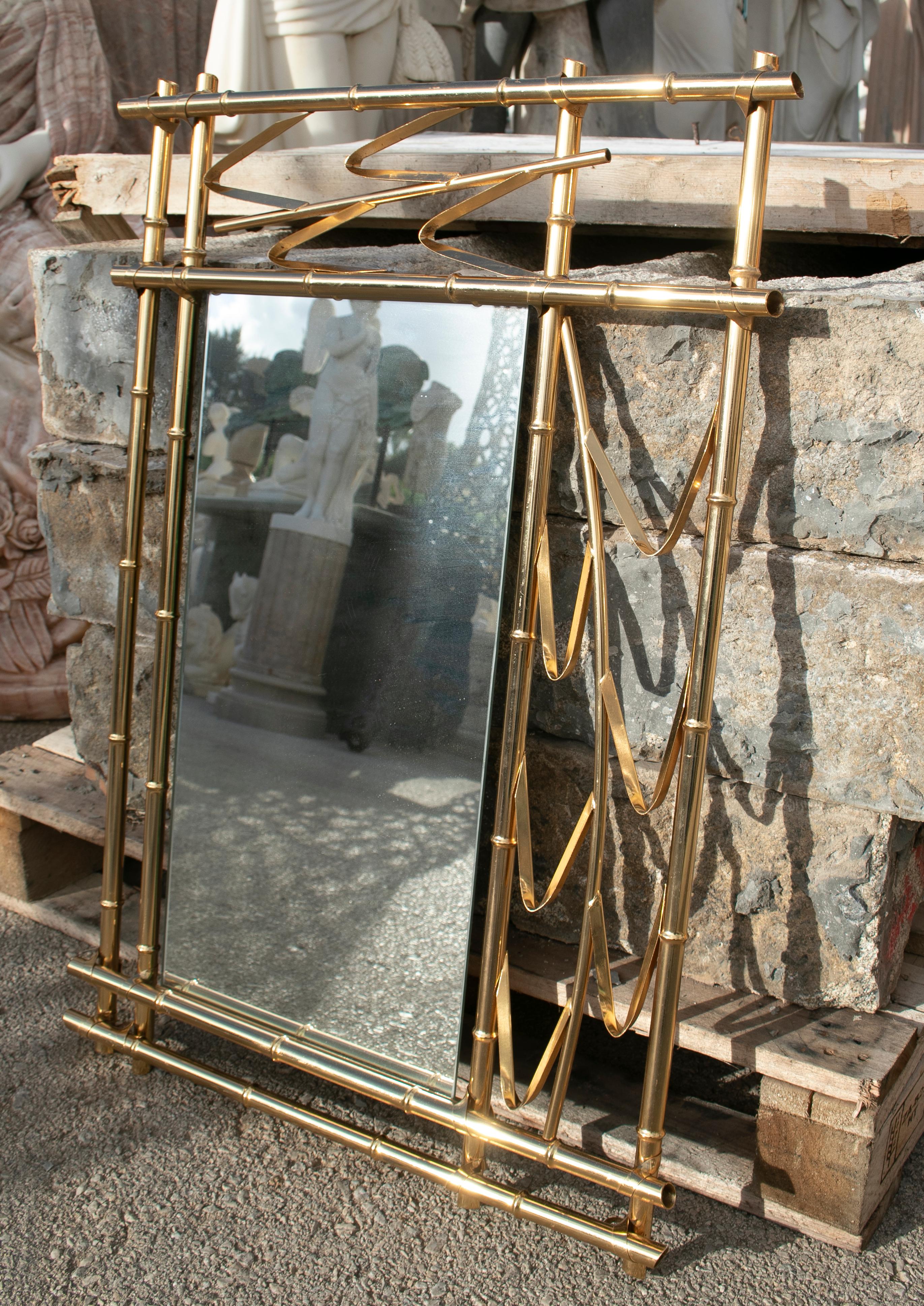 1970s Spanish faux bamboo golden iron mirror.