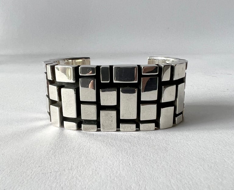 Spanish modernist geometric sterling silver mosaic grid cuff bracelet, circa 1970s.  Bracelet has a wearable wrist length of 7