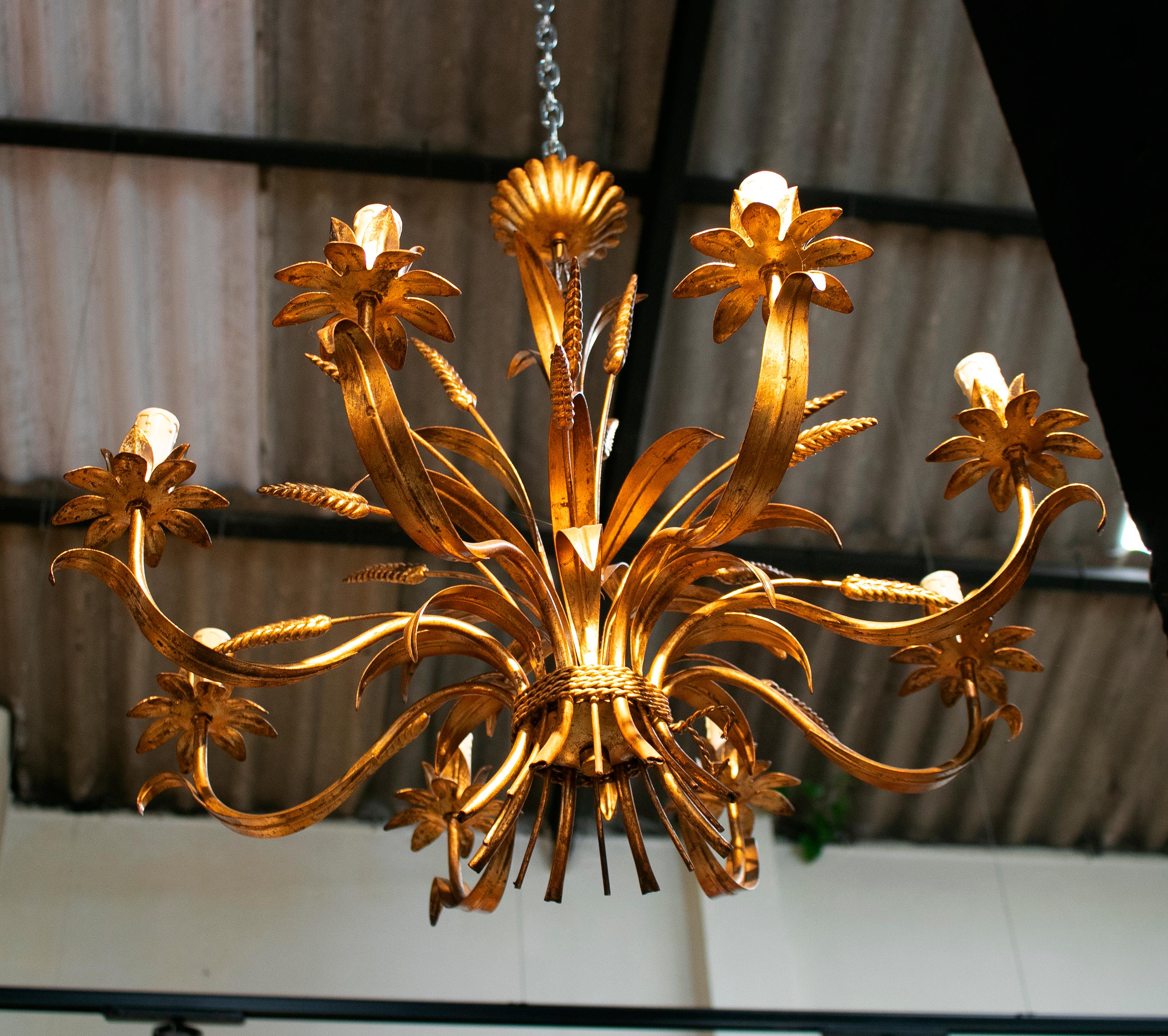 1970s Spanish golden iron ceiling lamp with flower decorations.