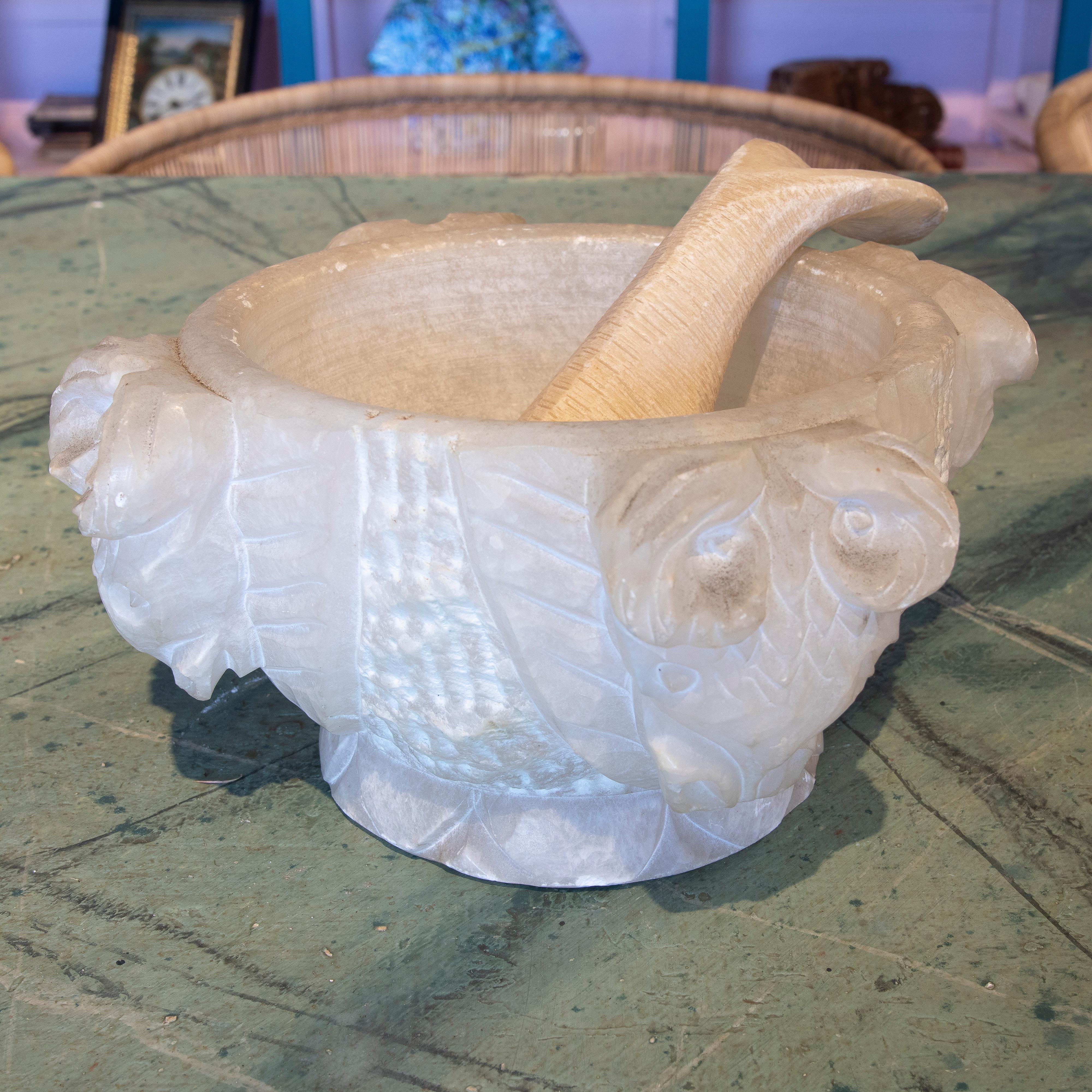 Rustic 1970s Spanish hand carved alabaster mortar and pestle decorated with four goat heads.