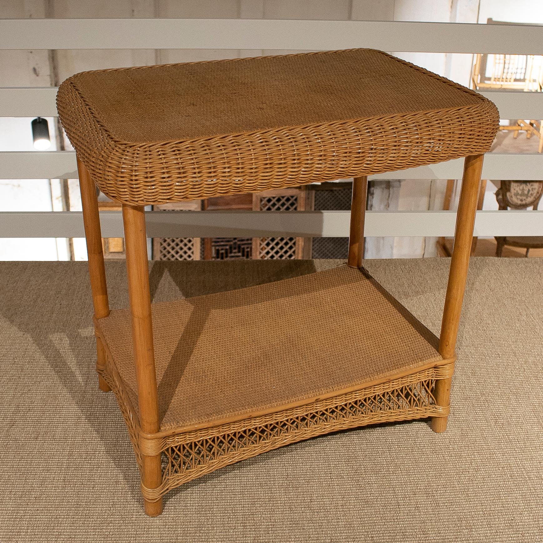 Vintage Spanish 1970s hand woven wicker and bamboo side table with low shelf.
