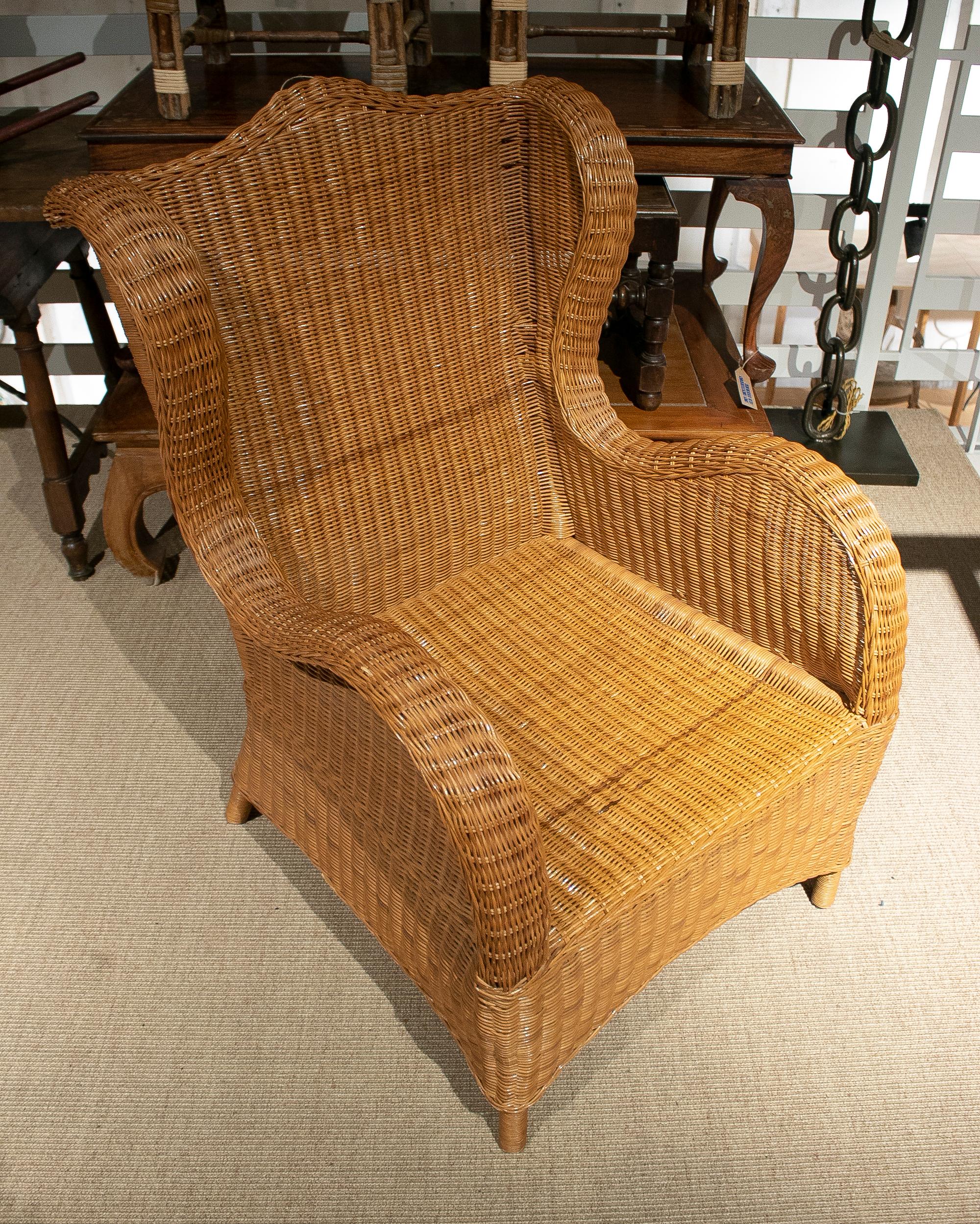 Vintage 1970s Spanish hand woven wicker wing chair.
