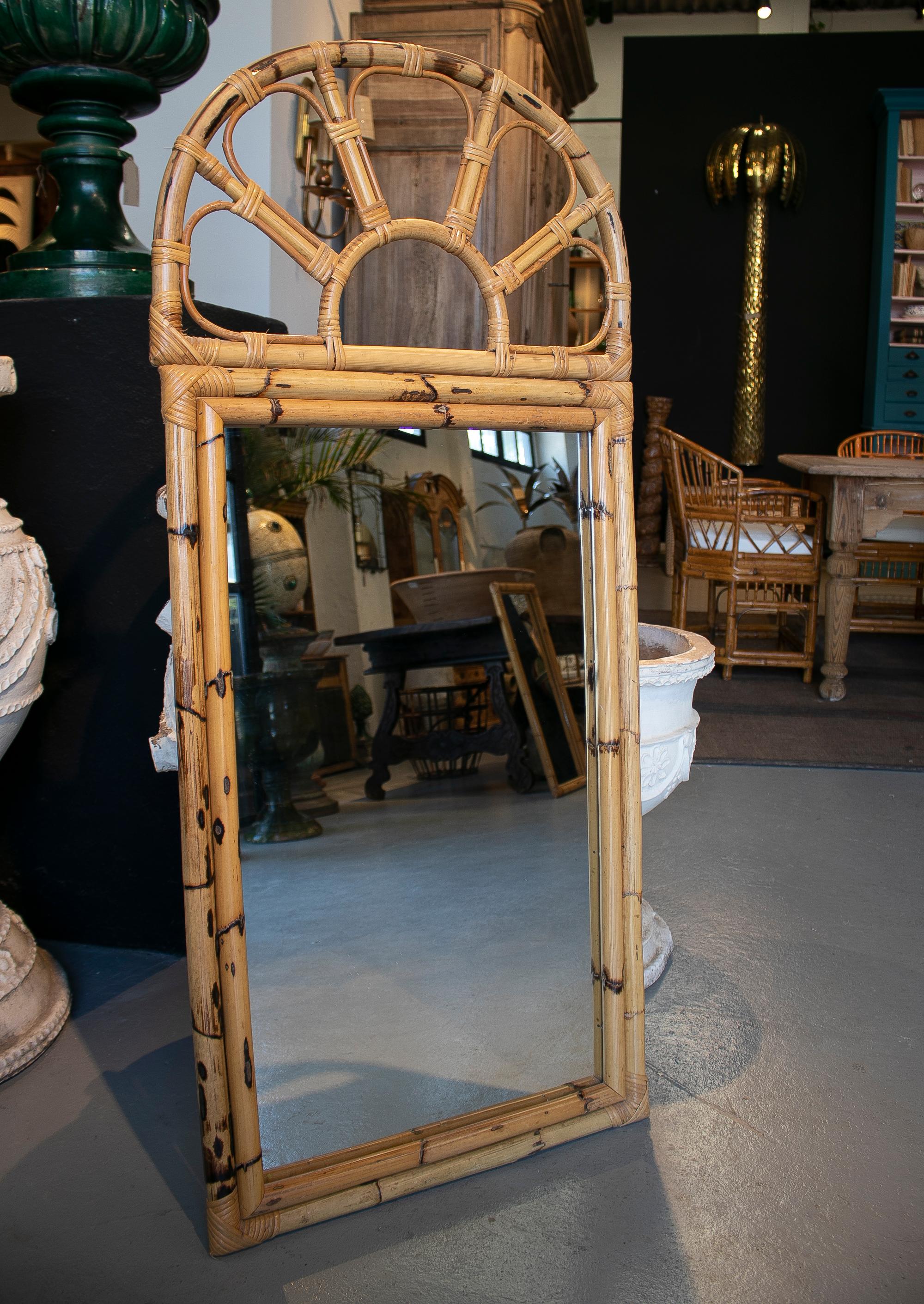 Vintage 1970s Spanish handcrafted bamboo wall mirror.