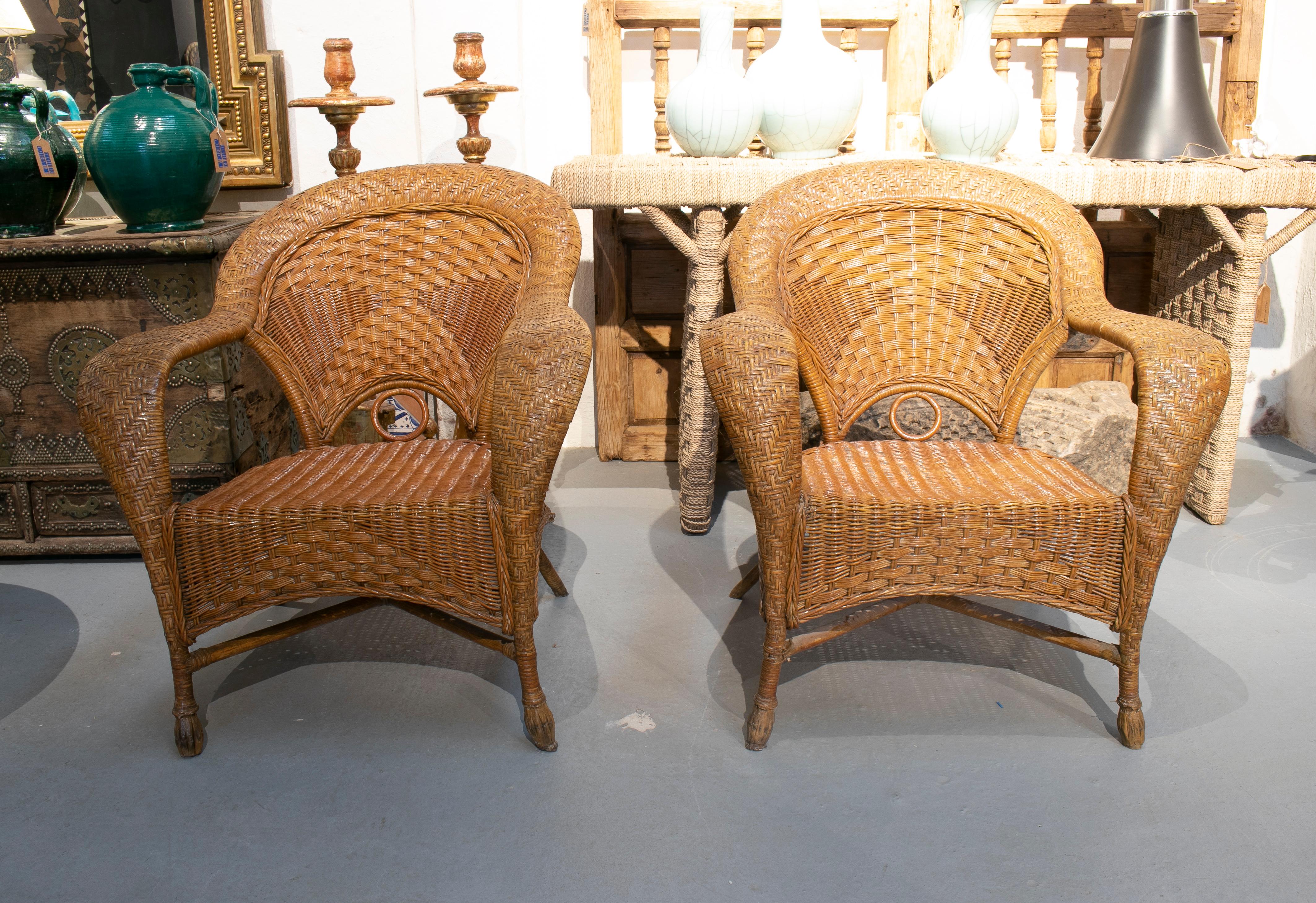 1970s Spanish pair of hand woven wicker armchairs.