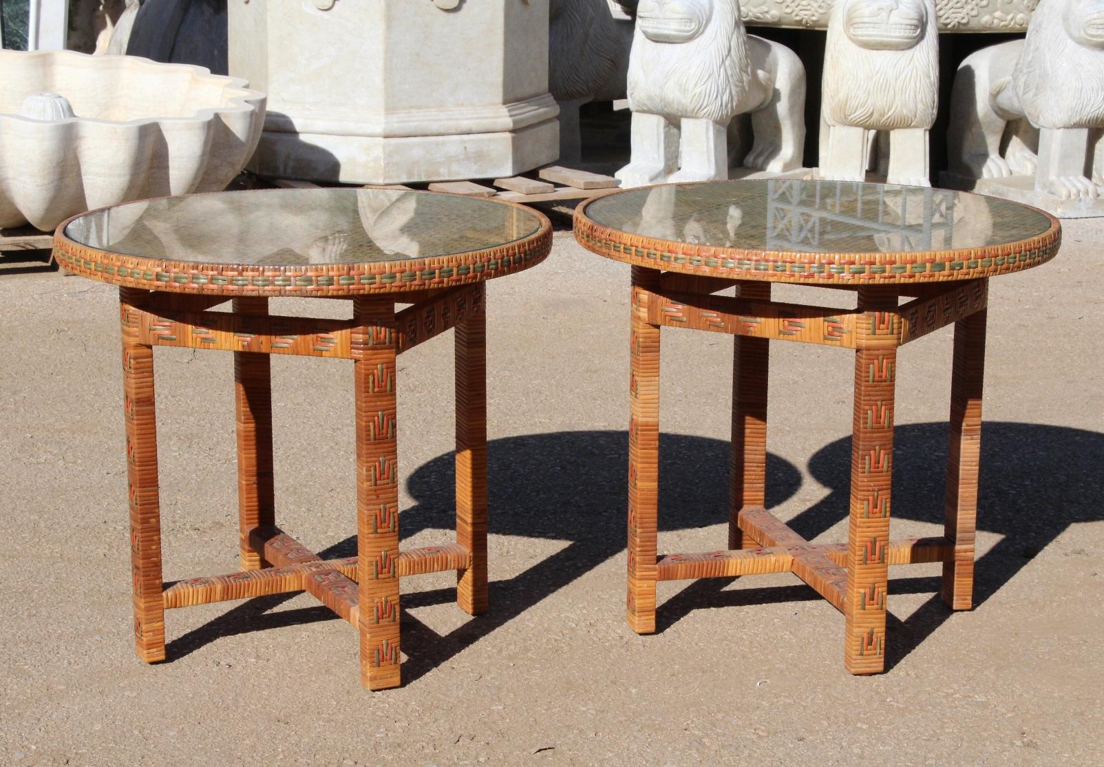 1970s pair of Spanish wicker small round side tables with brown, green and red hand woven geometric motifs. Lined wooden frame and glass top.

 