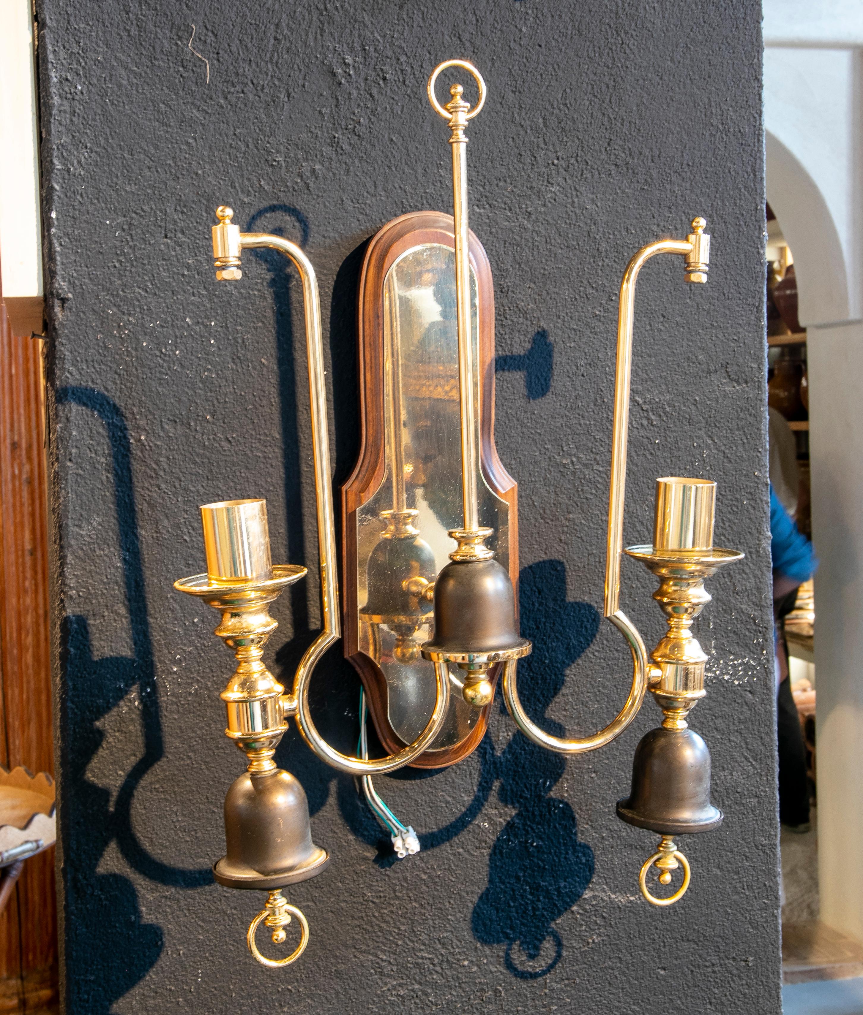 1970s Spanish pair of sconces in gilded metal and wood.