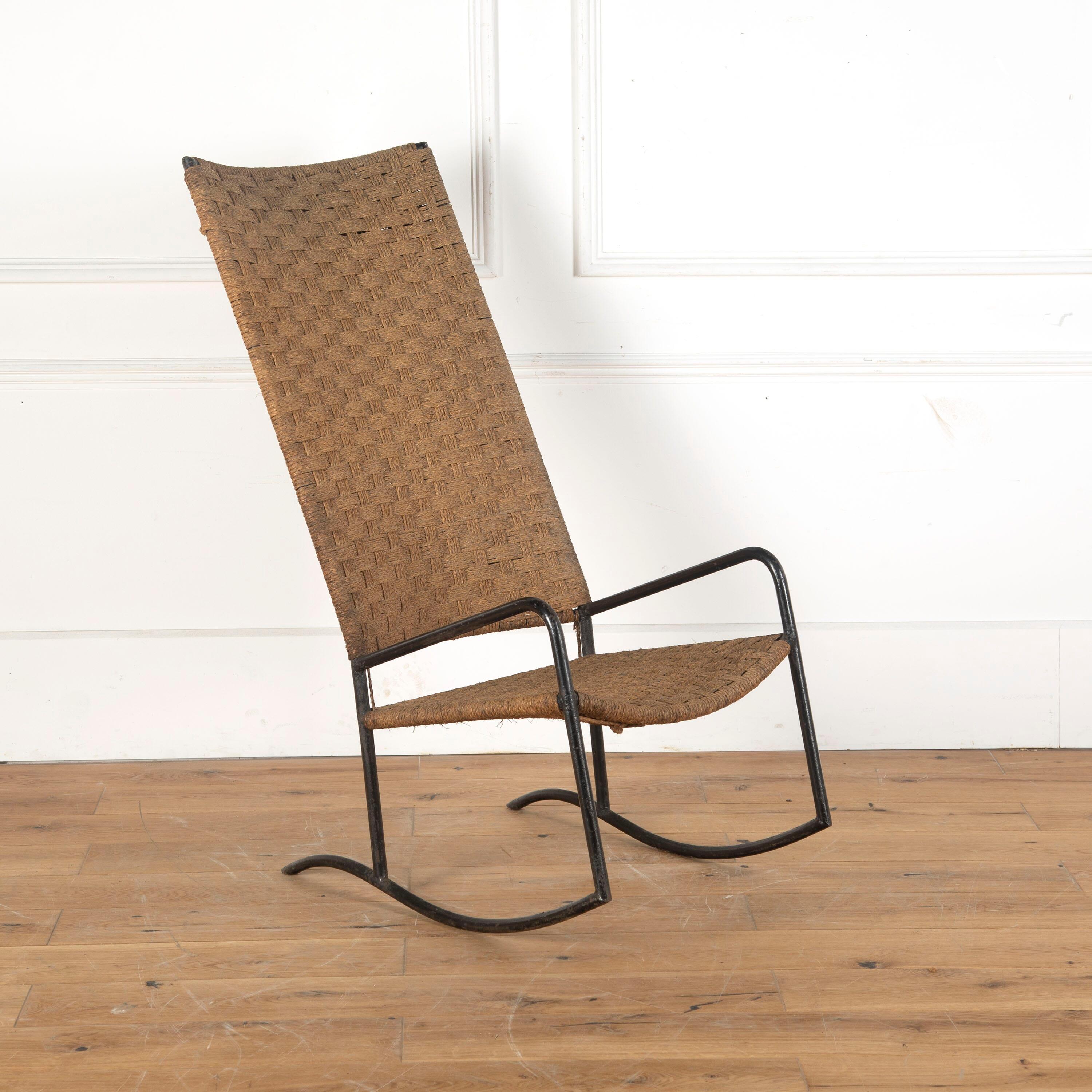 Stylish 1960s Spanish metal and seagrass chair, with a rocking base.

Featuring a long rectangular back and seagrass seat on a patinated tubular metal frame.